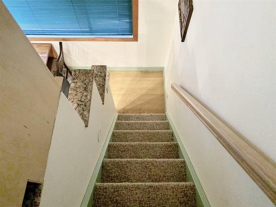 Stairs leading to and from loft area.