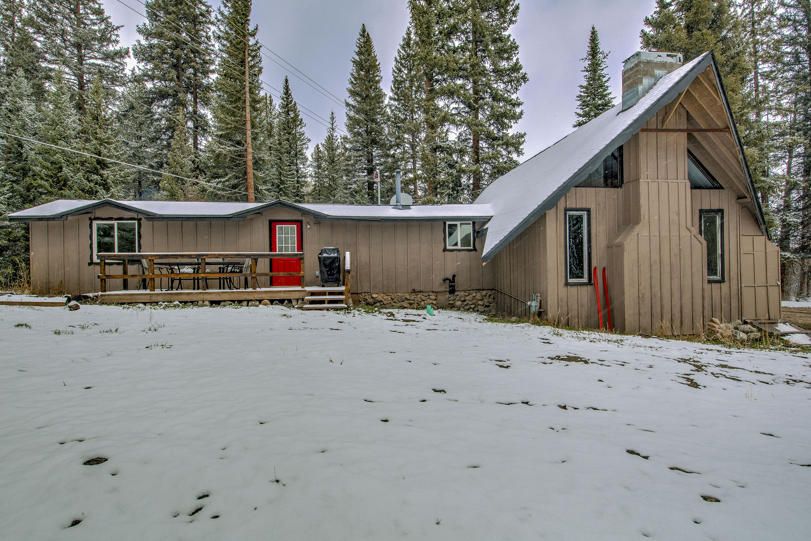 The Velvet Moose - known by the original owners as "the red ski cabin." Spread out in your private mountain getaway—snowy yard, forest surroundings, and a cozy cabin exterior that invites you to relax and make it yours.  