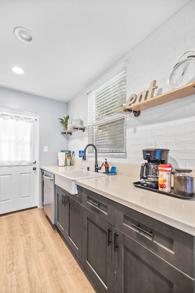 Our kitchen boasts a modern sink and dishwasher, ensuring easy cleanup and convenience. Don’t forget the coffee maker for your daily caffeine fix, all enhanced by a lively plant that brightens up the room!