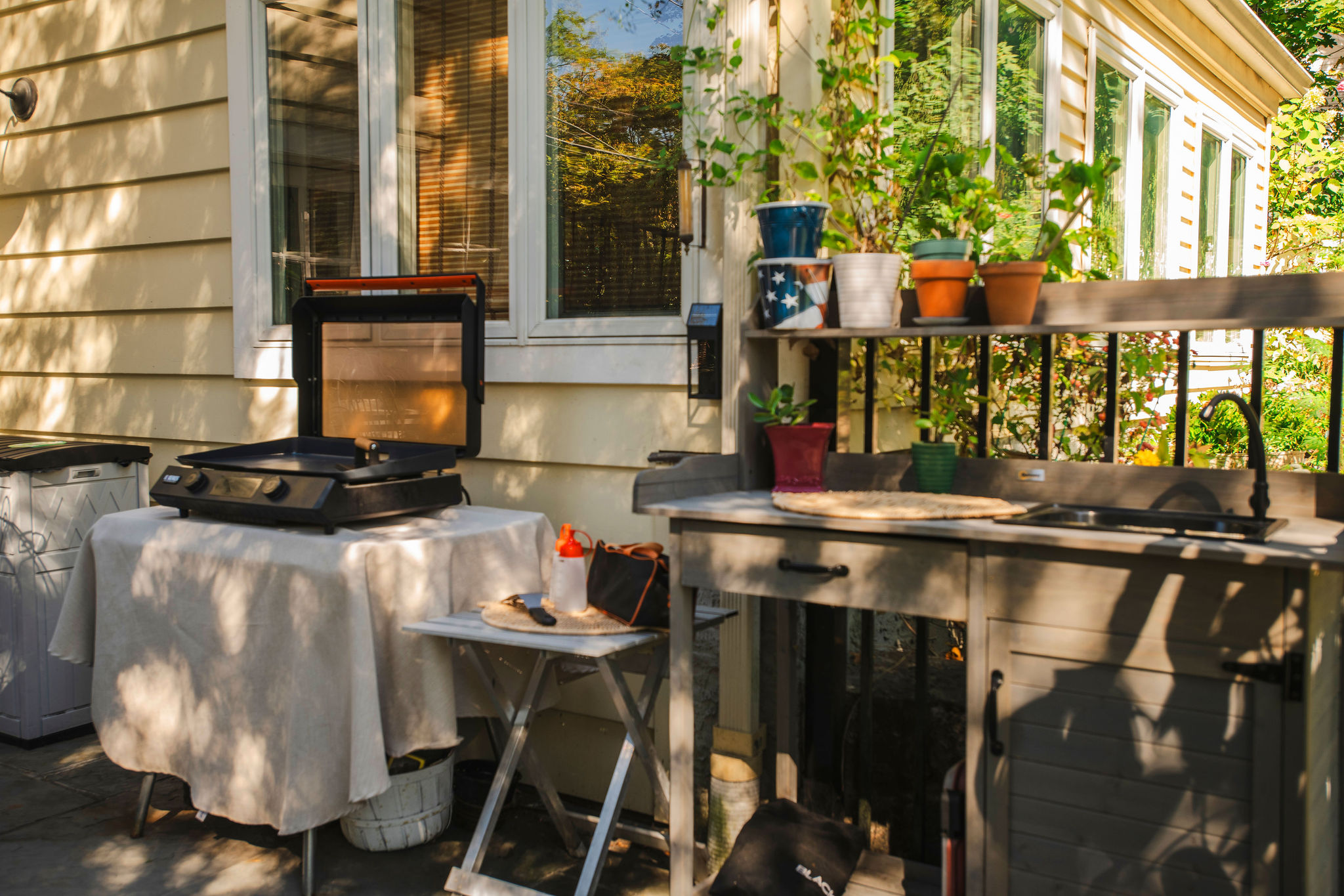 Outdoor grill and dining area on our patio.