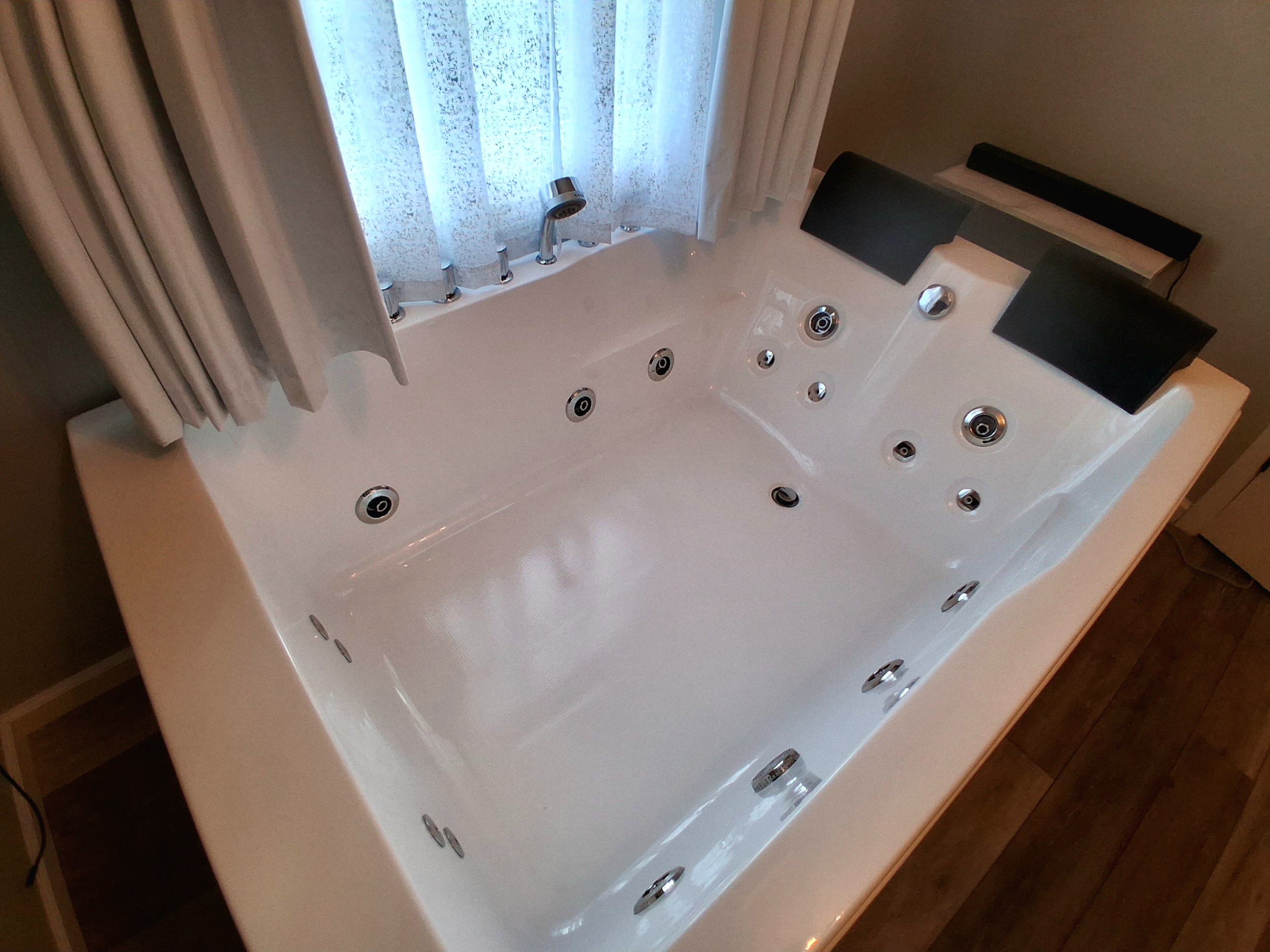 Luxe & Serene:  Enjoy the gentle bubbles of a heated jetted tub for two, designed for pure relaxation.