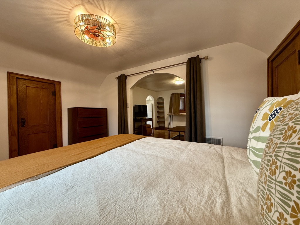 Bedroom with plush Queen bed.
