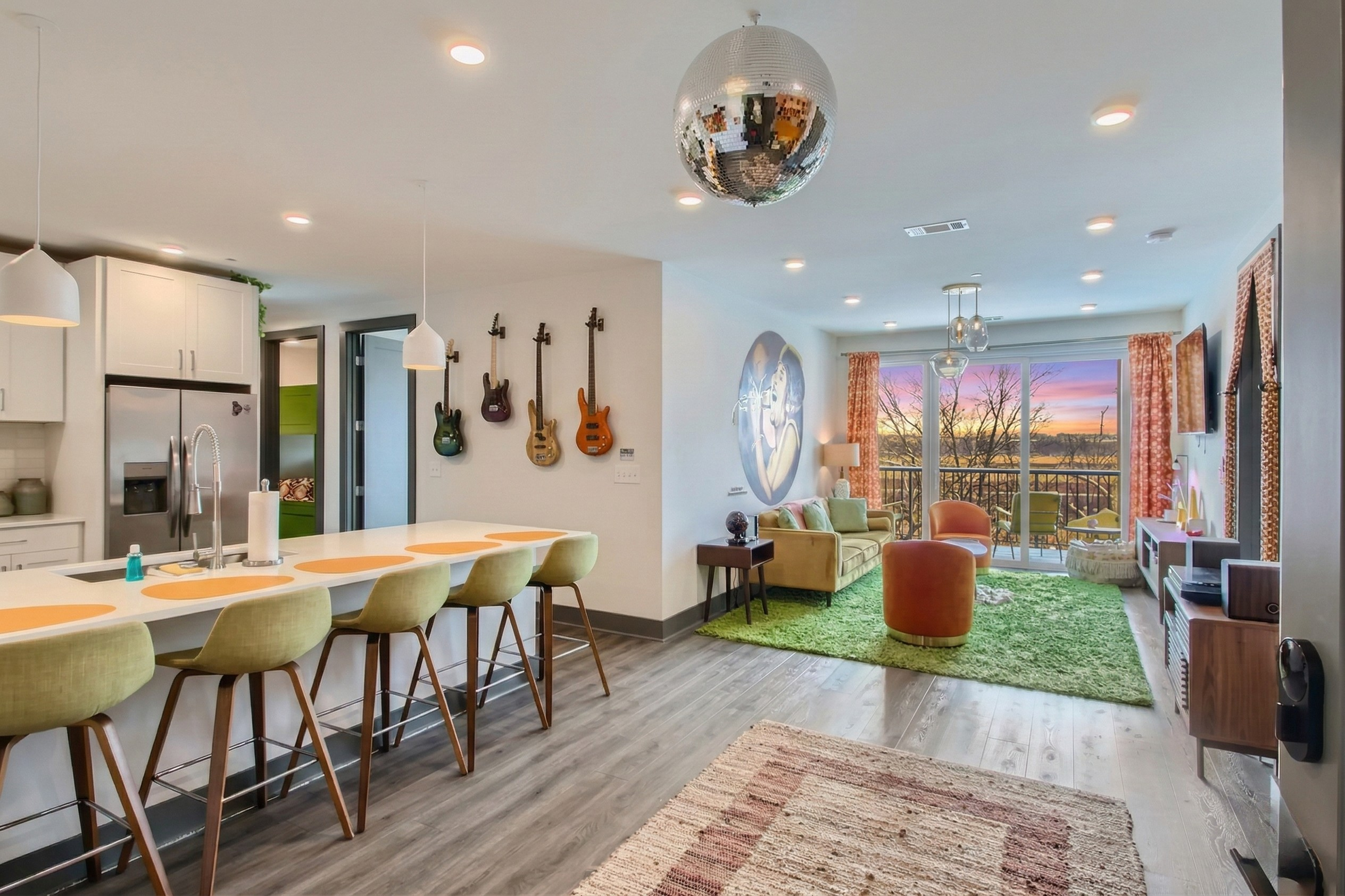 Step into the groove of our Soul Train-inspired condo! The retro entrance exudes vibrant nostalgia, with a Aretha Franklin mural and a glimpse of the soulful, open living space beyond. Your stylish journey awaits!