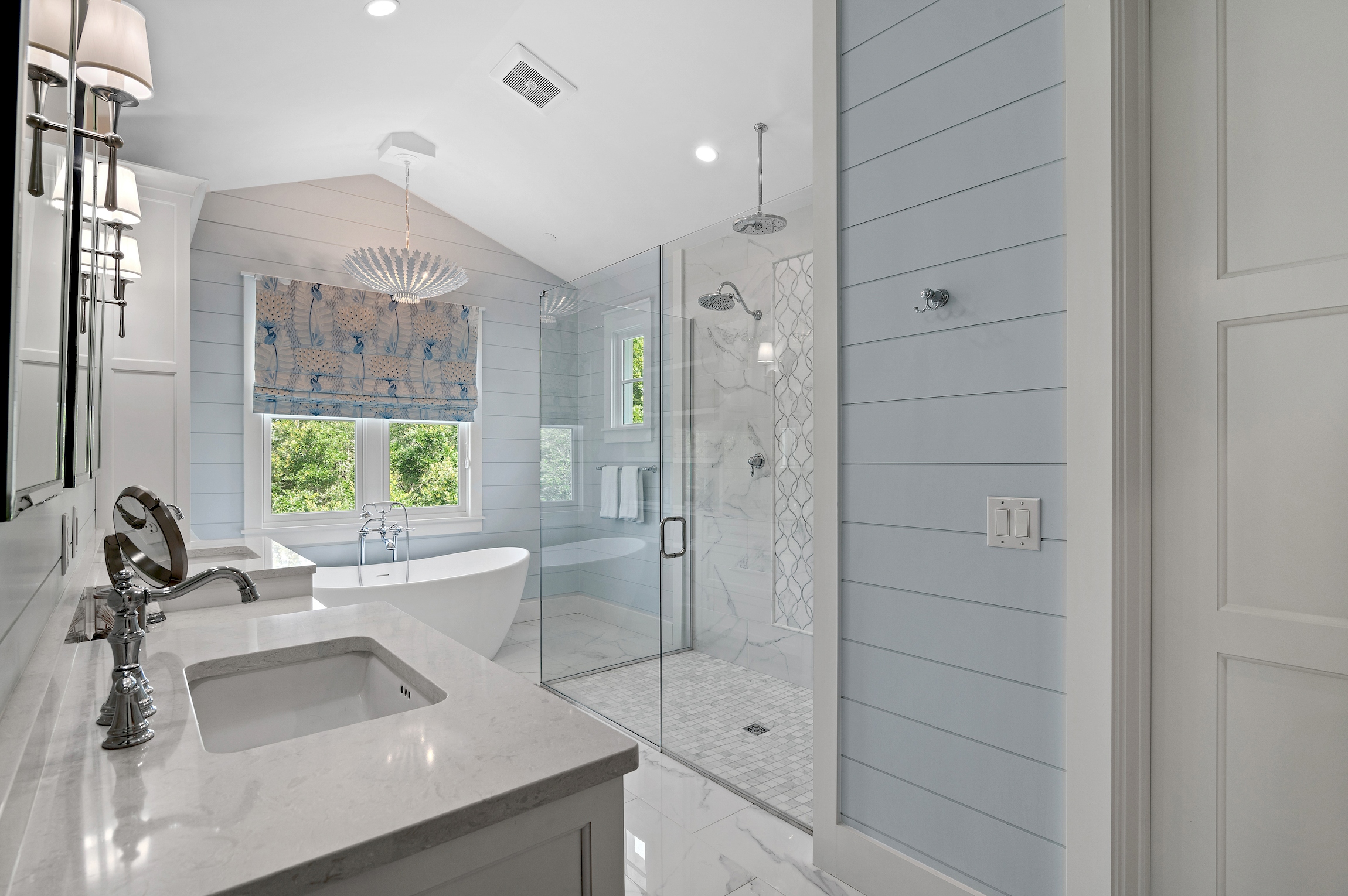 An oversized shower, double vanities, makeup vanity, soaking tub, and water closet round out the Master Bath.
