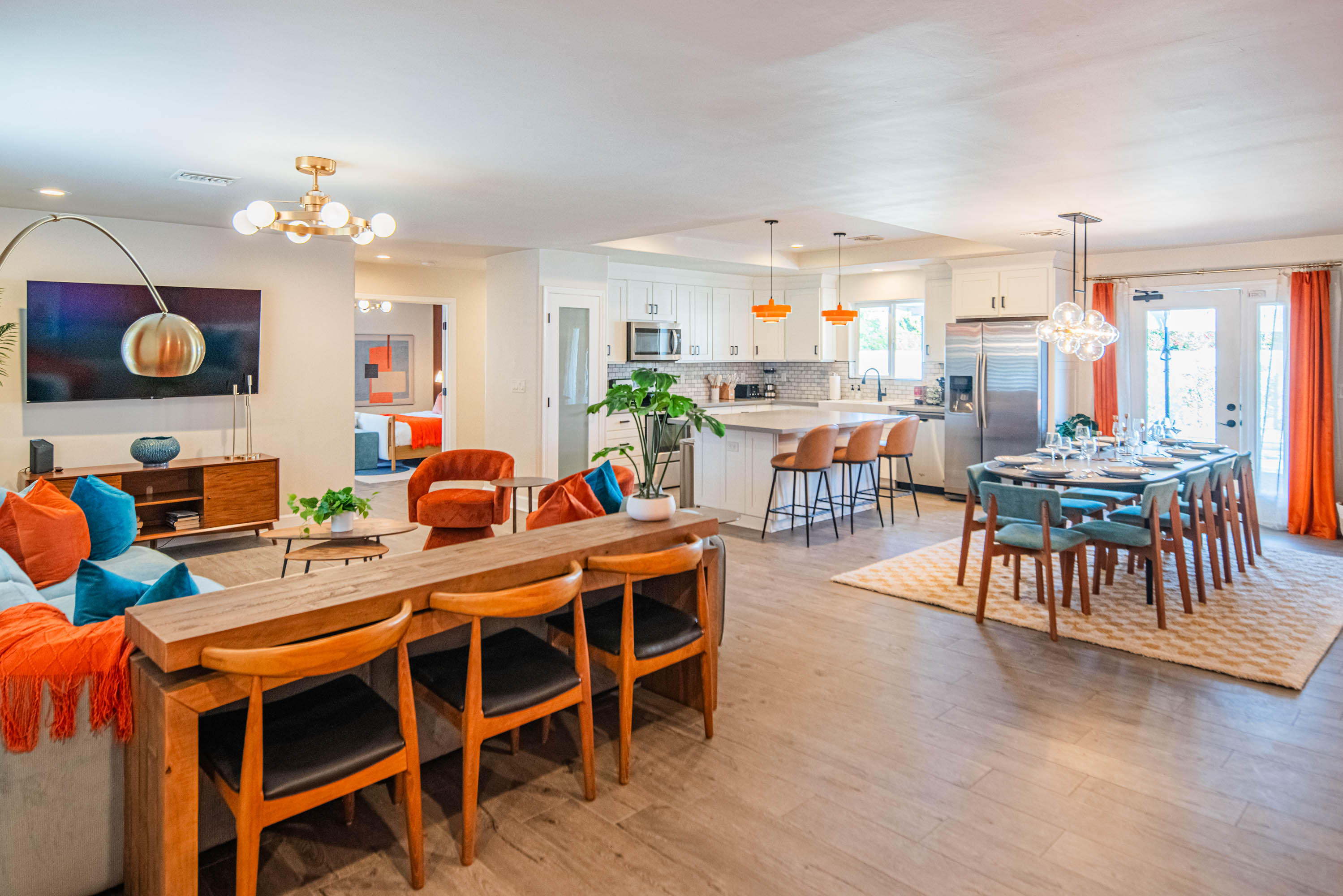 Bright open-concept layout connecting the living room, dining area, and kitchen — perfect for group stays, family gatherings, and entertaining during your Scottsdale vacation.