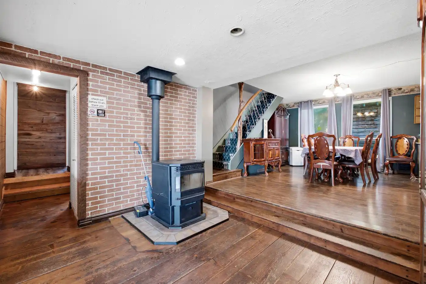 Open living and dining area with wood stove