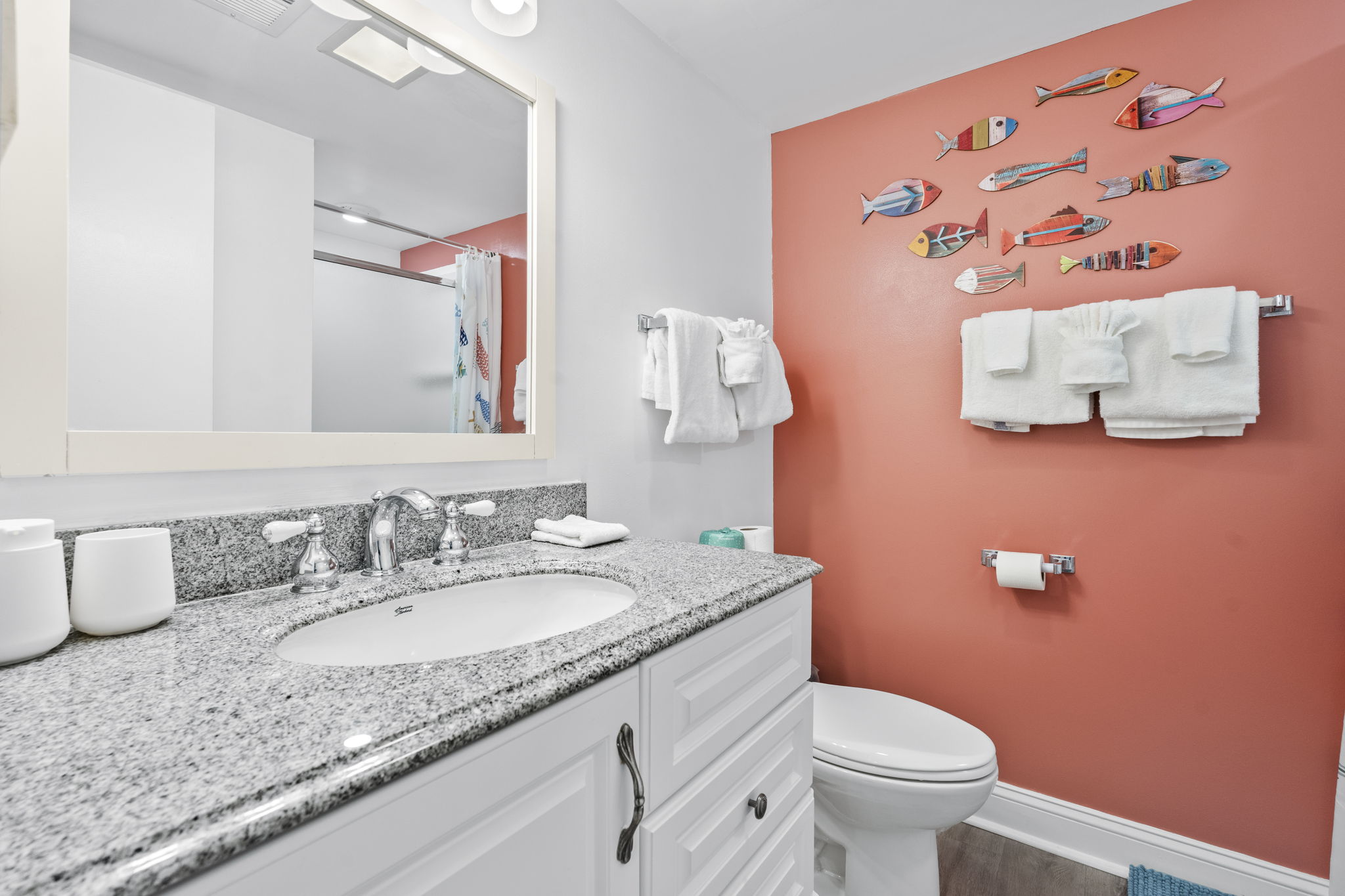 Bathroom with granite vanity and fresh towels