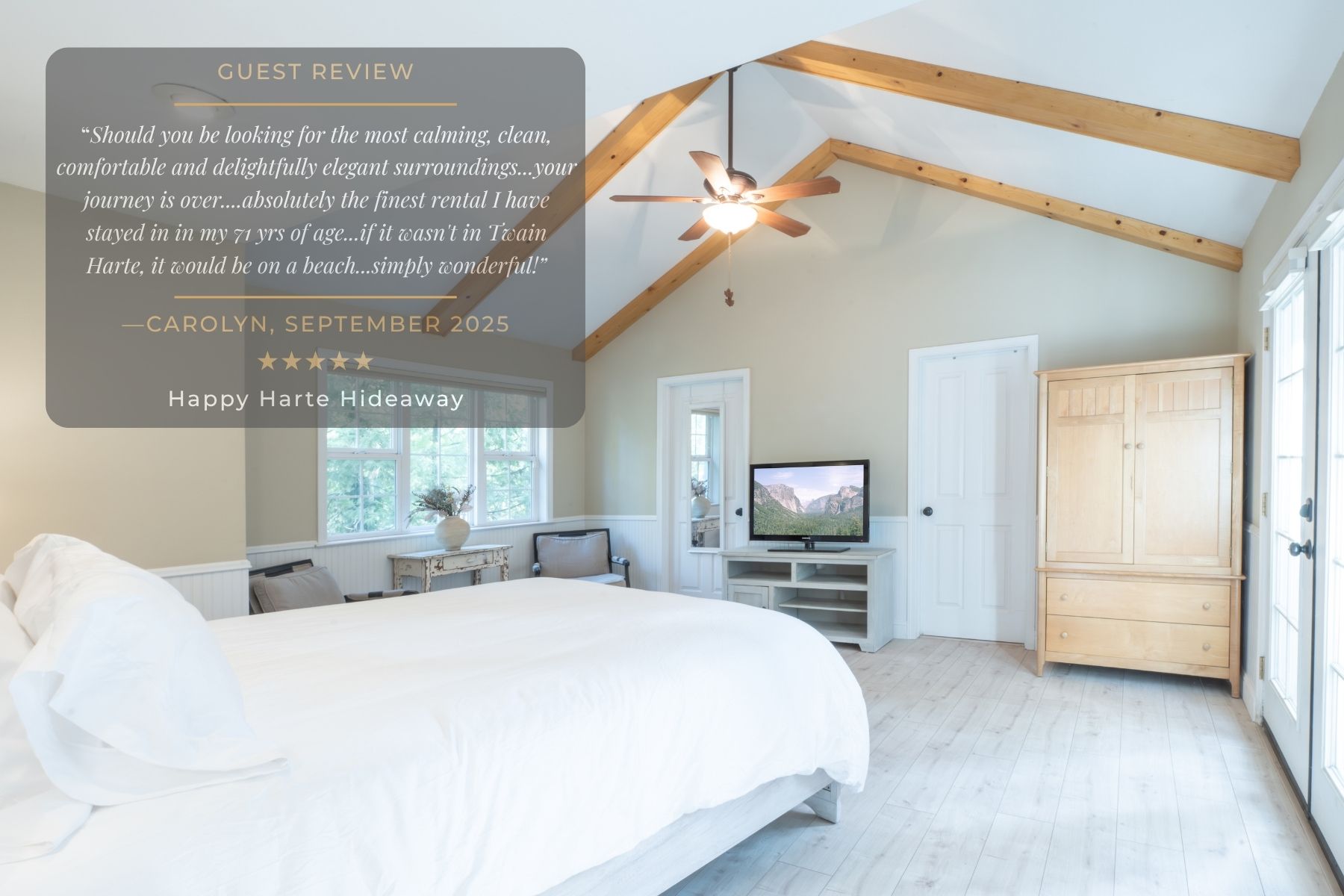 Large, comfortable bed with a simple yet elegant headboard, softly lit by wall-mounted lamps, creating a tranquil space for rest.