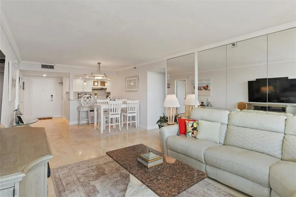 Bright and inviting, the living room is filled with natural light and offers a comfortable space to relax, stream your favorite shows, or unwind together while enjoying the coastal bay area ambiance.