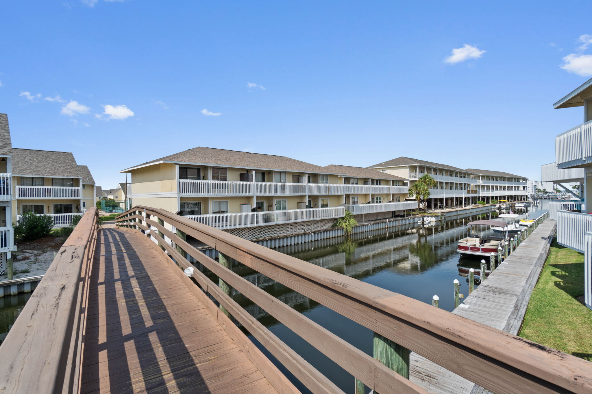 A boater's paradise! Look out from the small balcony to see the boat slips and saltwater canal activity happening right below you.