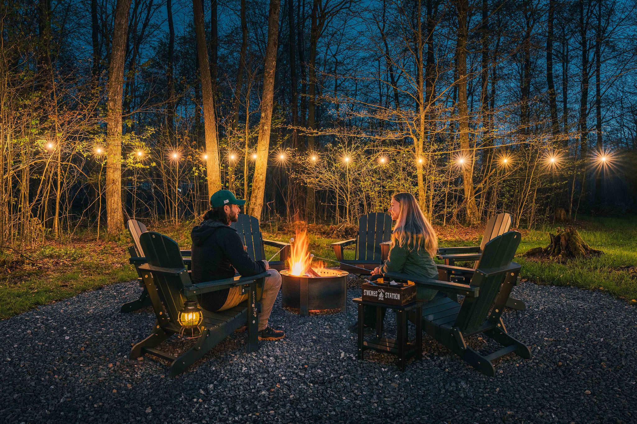 🔥 Gather around the firepit under string lights as the forest goes quiet.