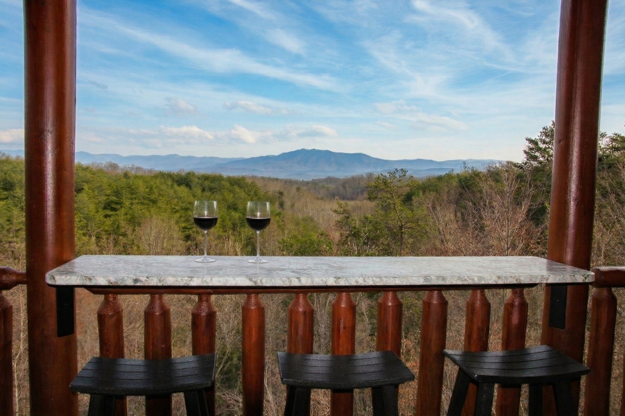 Private deck bar with a breathtaking Mount LeConte view, made for sunrise coffee, evening wine, and quiet mountain memories.