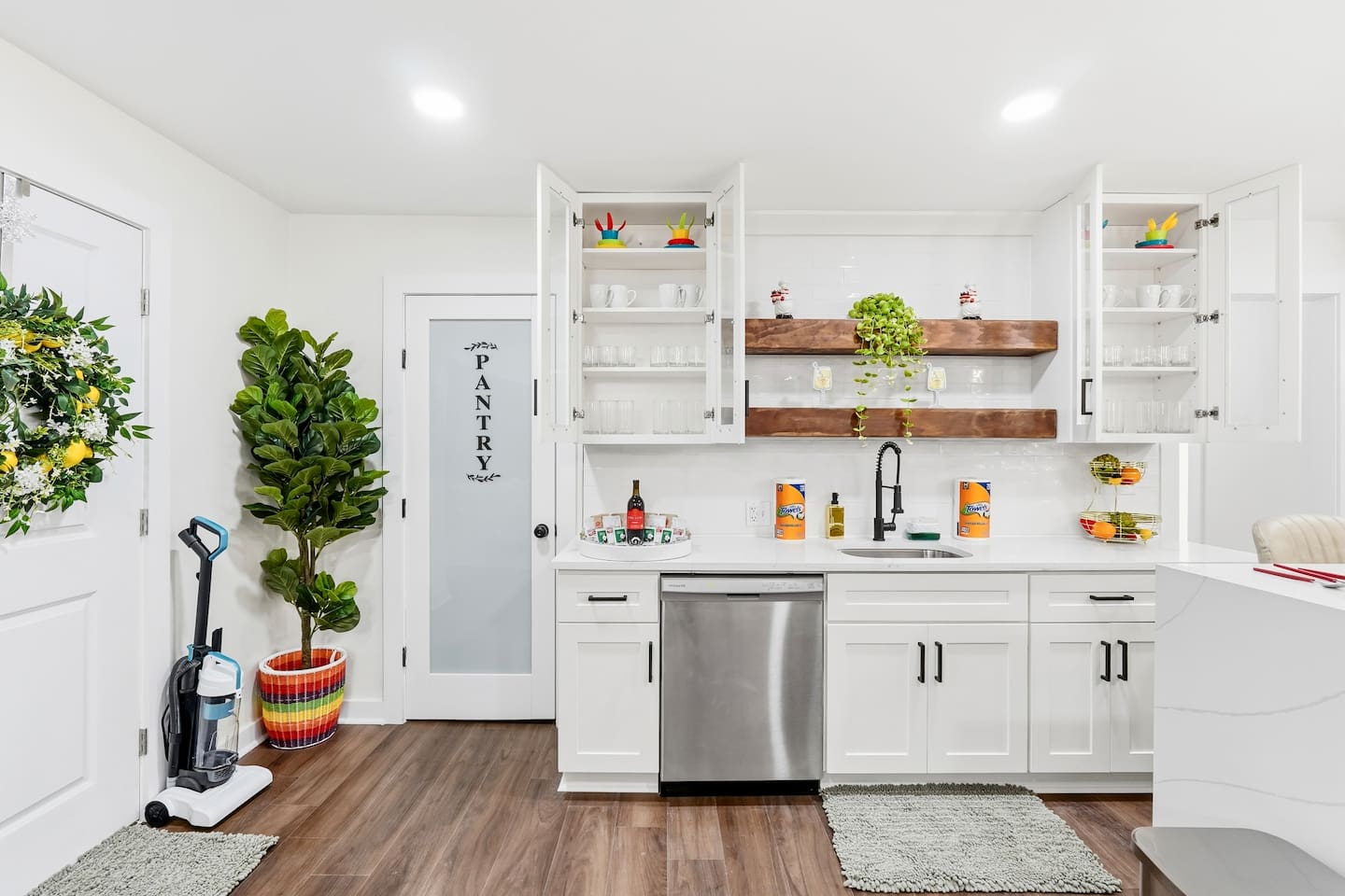 Beautiful white kitchen fully equipped with all the appliances and essentials of a home away from home.