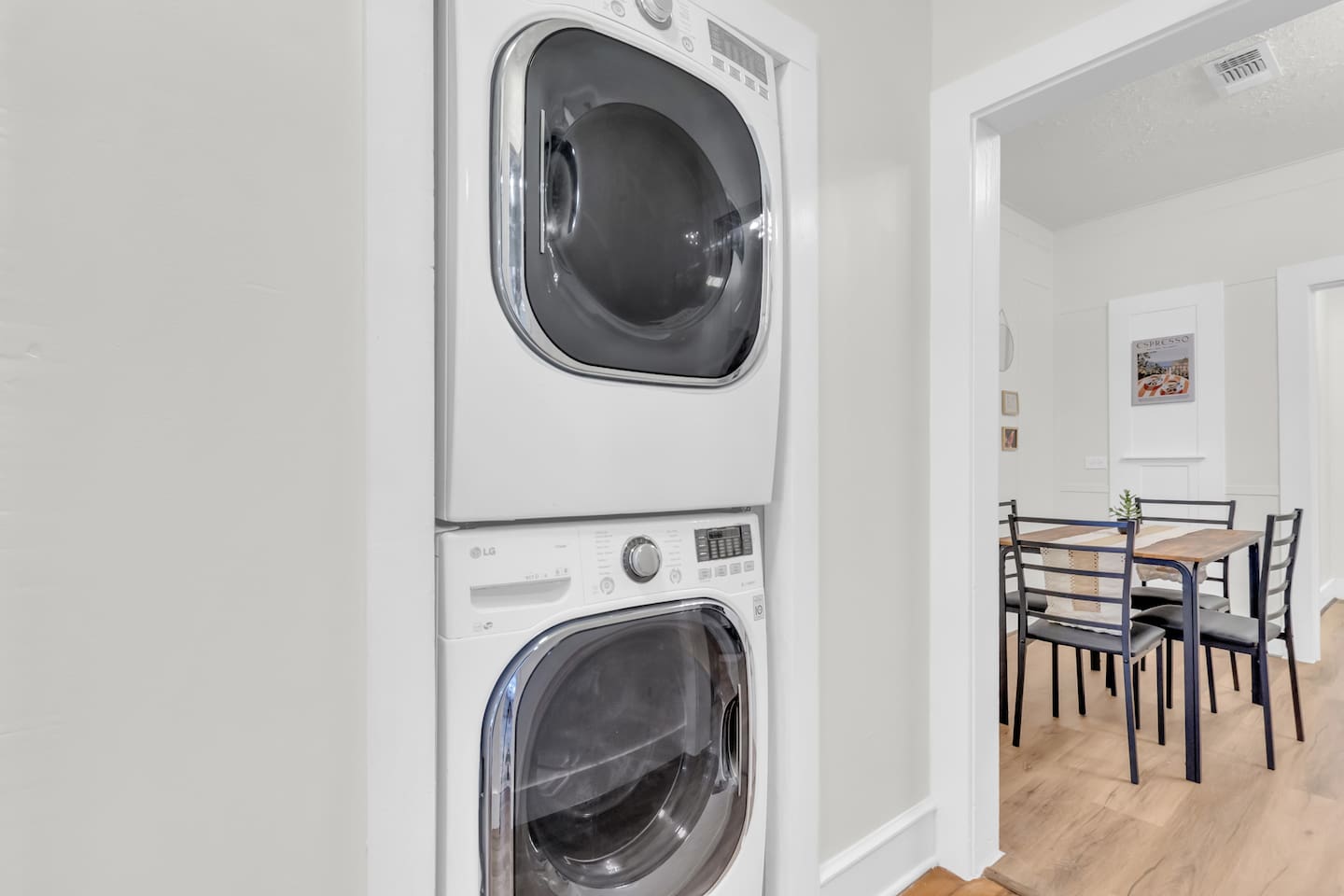 Laundry room with washer and dryer for guest convenience.