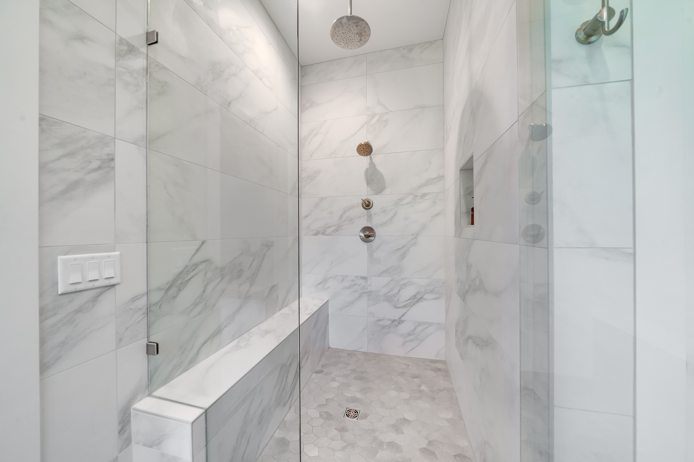 Ensuite Bathroom 2 - Attached to King Suite 2. Featuring oversized rain shower with dual showerheads, soaking tub and spa-quality marble finishes. Includes premium toiletries (body wash, shampoo, conditioner, hand soap) and hotel quality towels.