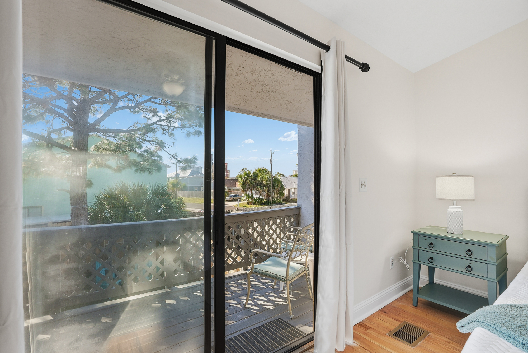 Bedroom #1 with King Bed and Balcony Access Overlooking the Back Yard