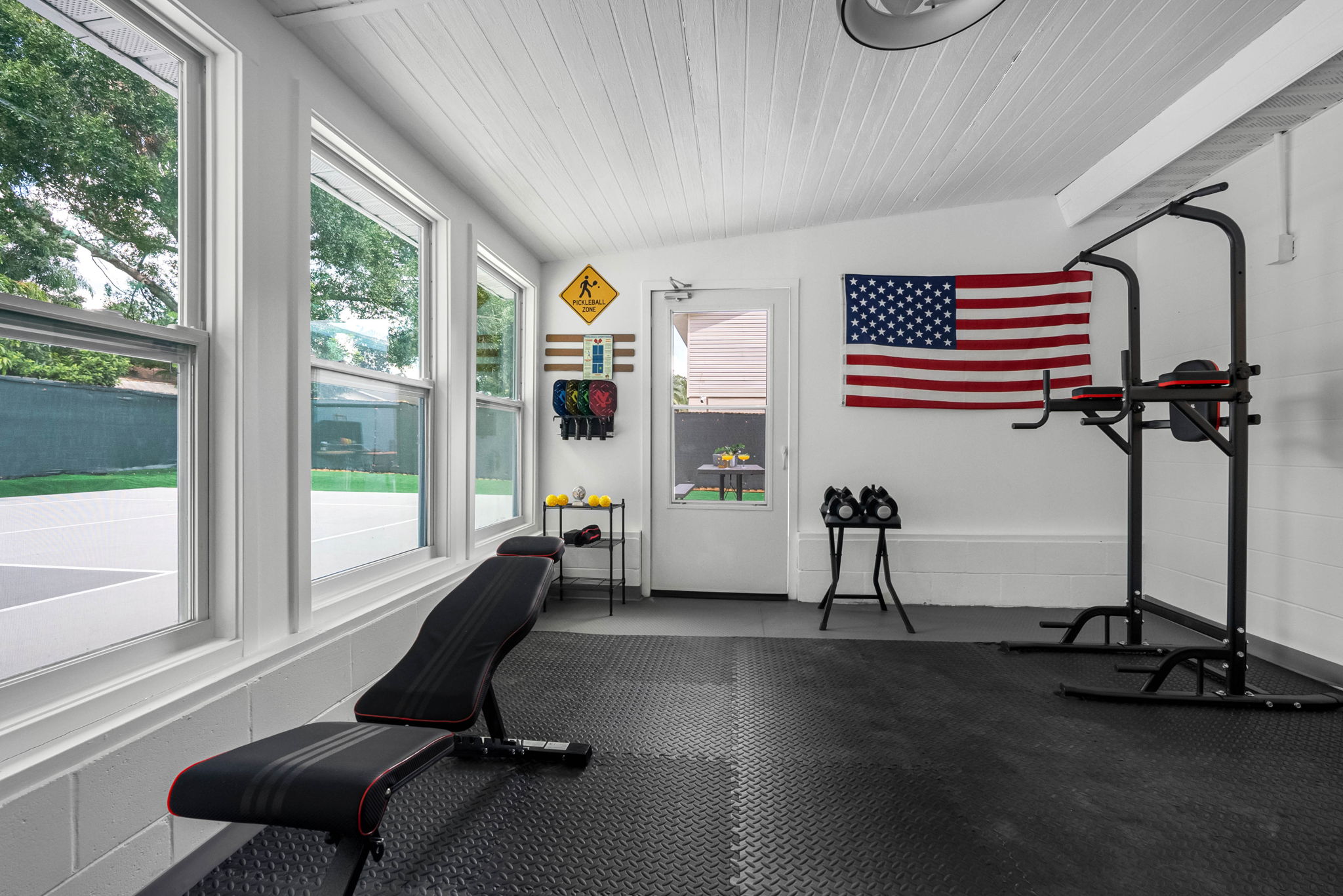 Includes dumbbells, a bench, a power tower, and space for bodyweight circuits.