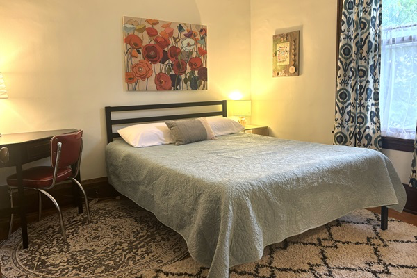 Cozy queen bed in the Poppy Room