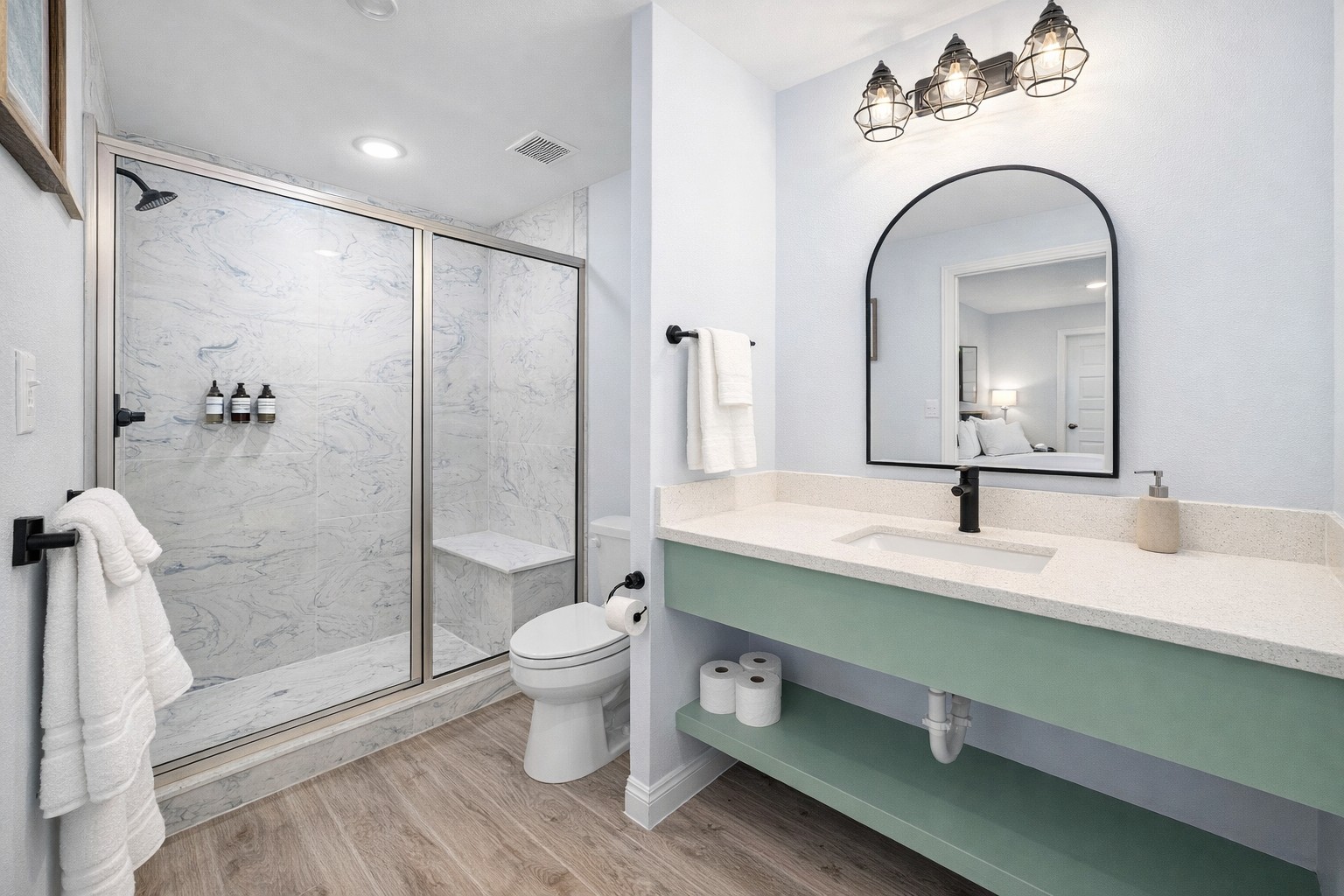 Second Primary Ensuite (Upper Level): Sleek walk-in shower and private access from the upstairs king suite.