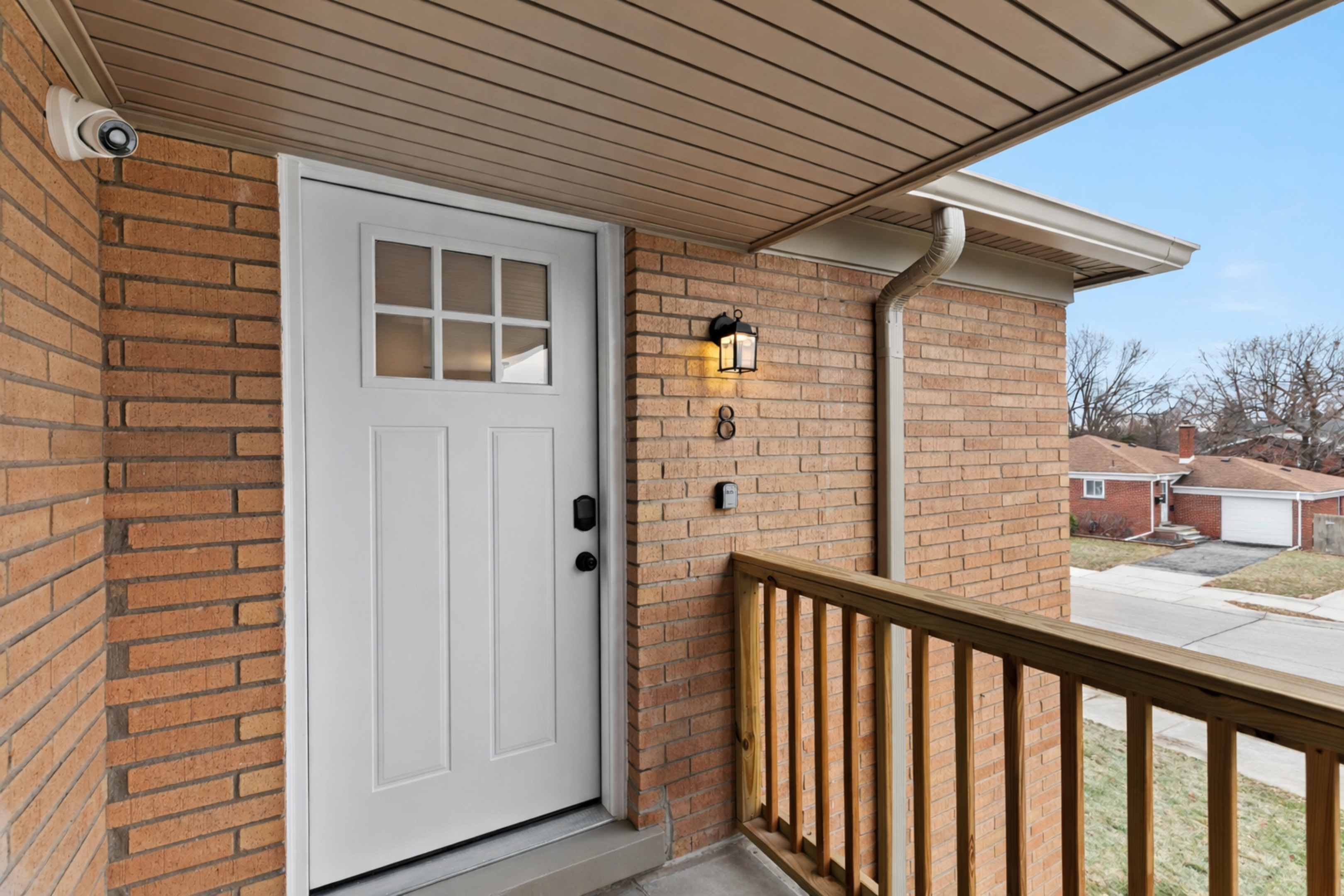 Private entry with a covered porch, smart lock access, and welcoming lighting—easy check-in and a secure, comfortable arrival every time.