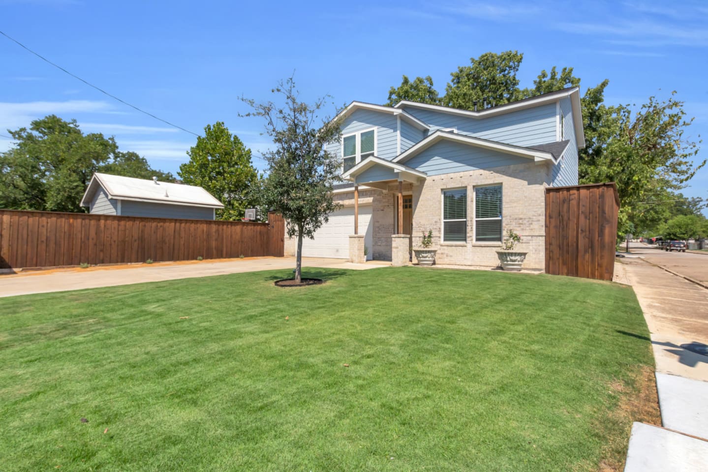 Welcoming modern home with fresh landscaping and stylish curb appeal.