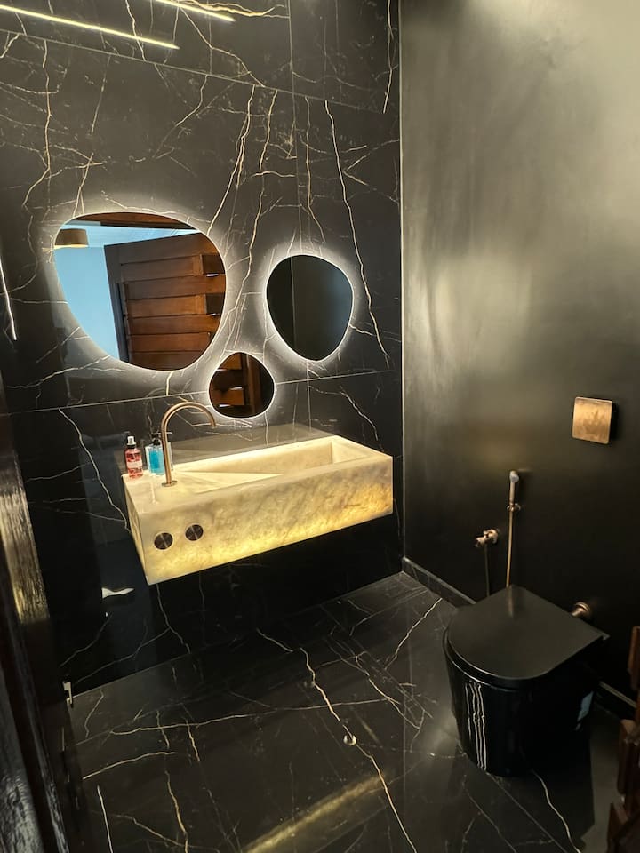 Powder room that we designed with translucent onyx stone!