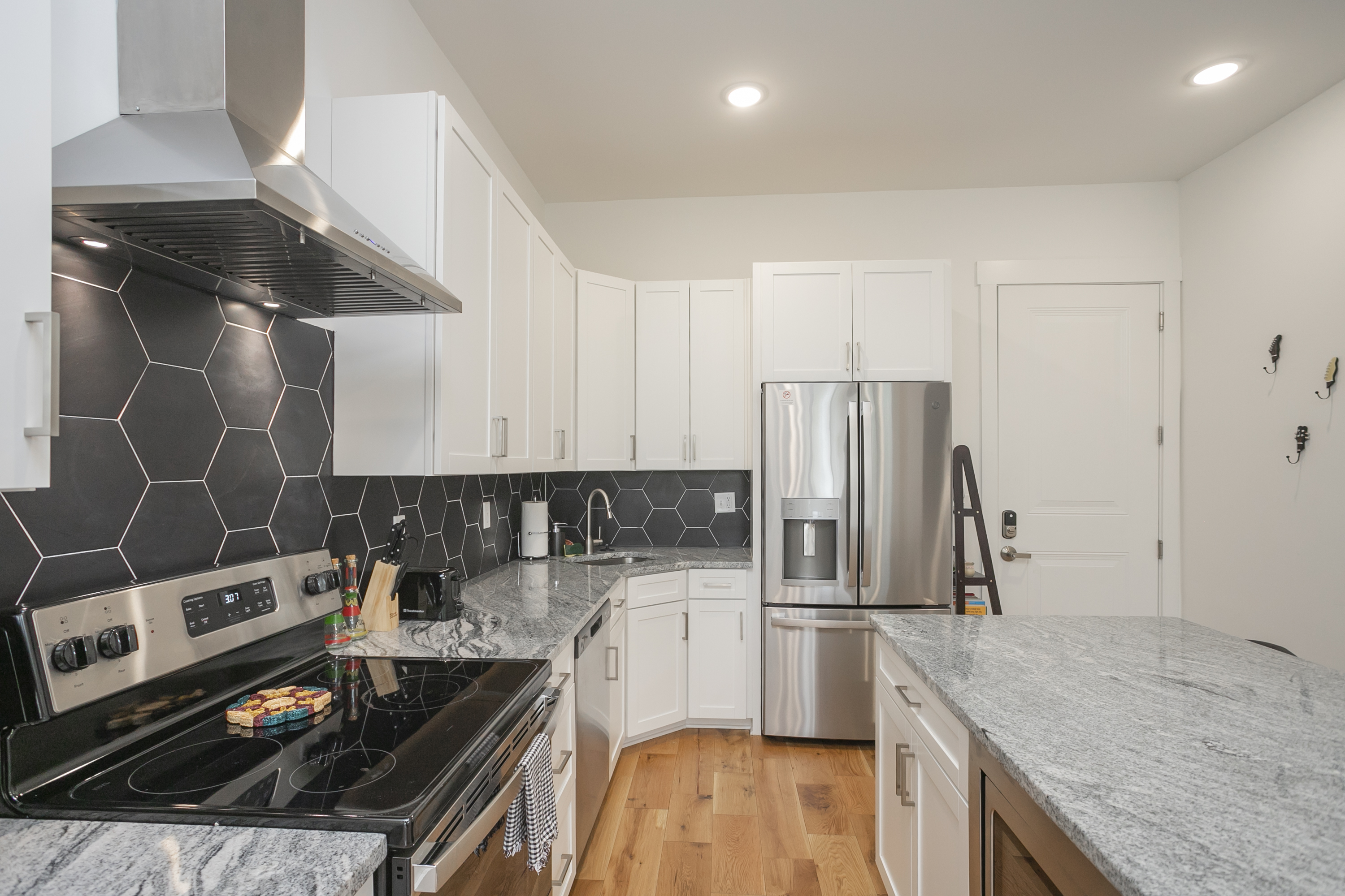 The kitchen has a flat top stove and everything you need for your stay.