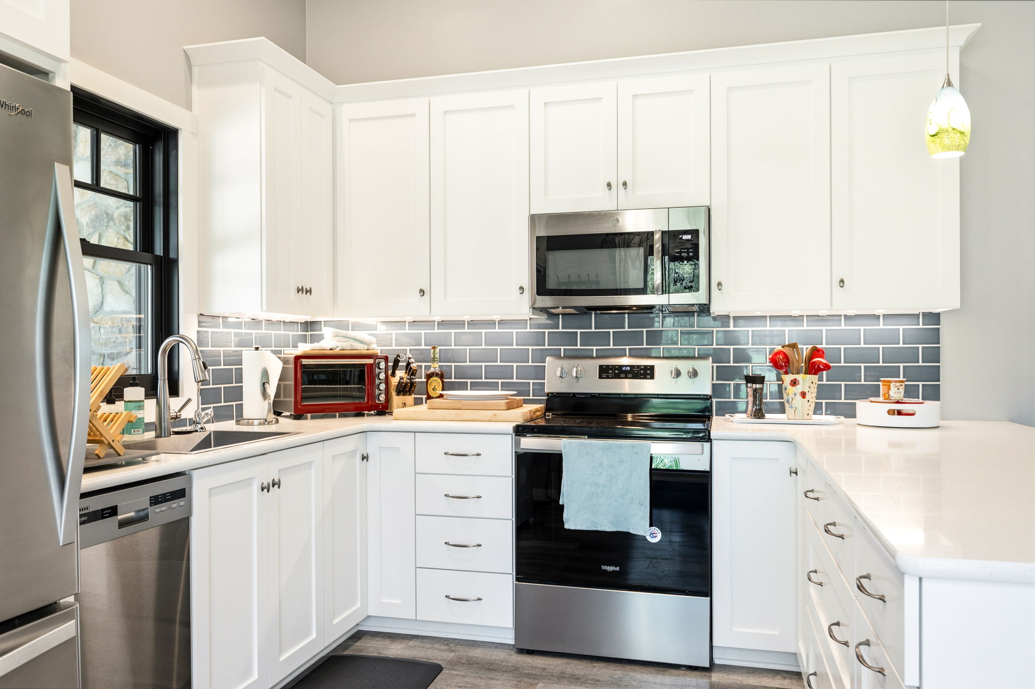This chef-ready kitchen offers full-size stainless appliances, quartz counters, and everything you need to whip up a home-cooked meal.