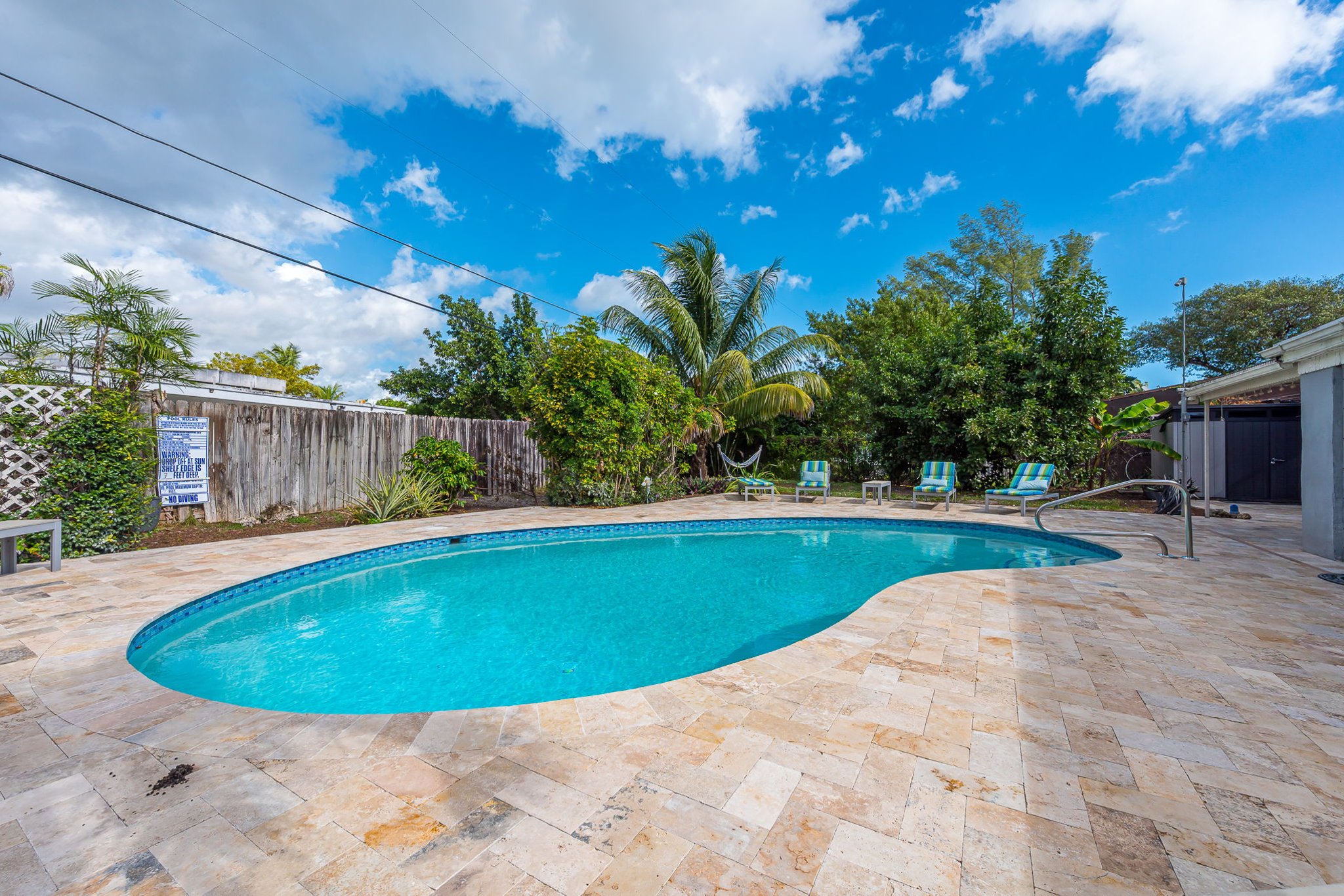 The outside is a highlight, with the heated pool, outdoor sun- loungers, BBQ and covered dining area.