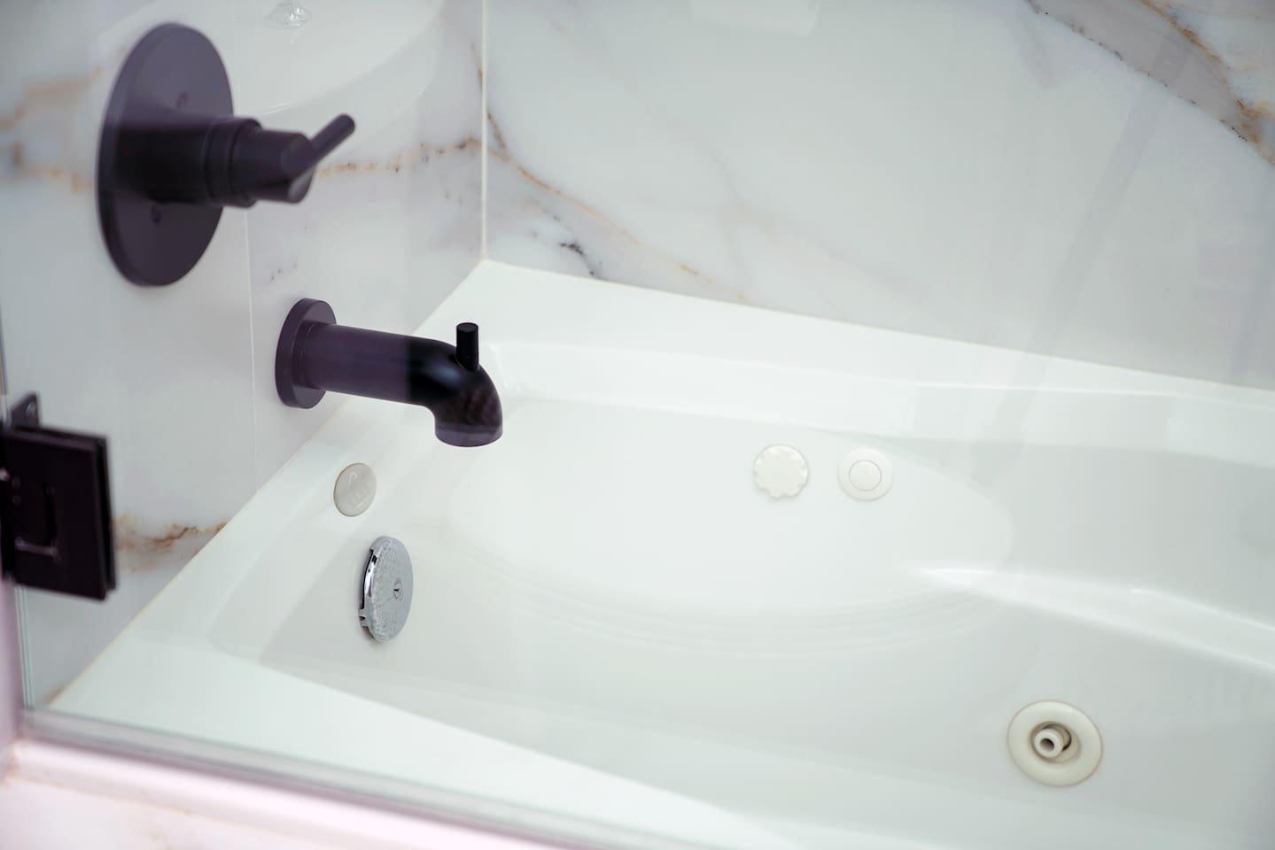 Jetted soaking tub for complete relaxation.