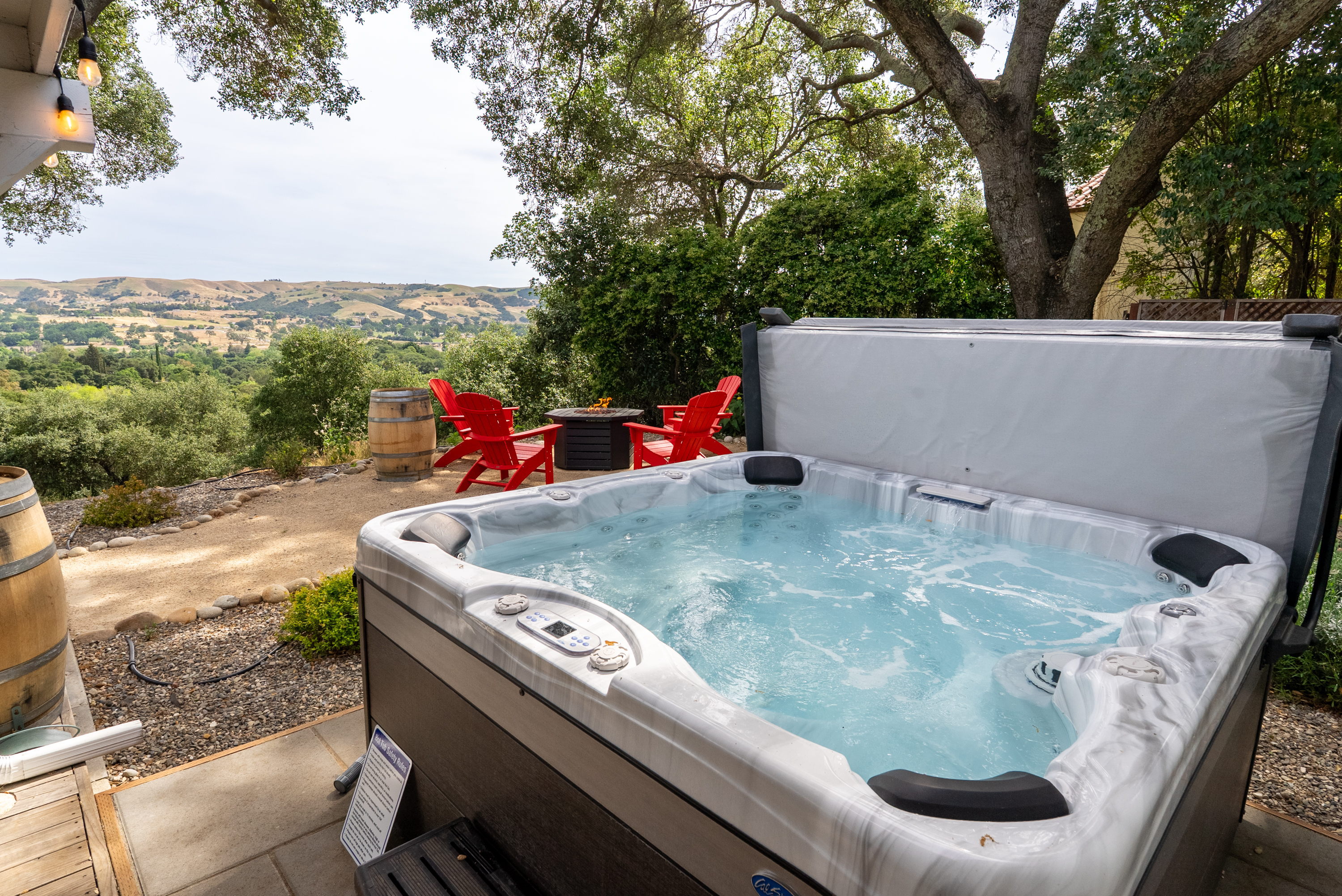 Experience the warmth of the hot tub in this private hilltop retreat.
