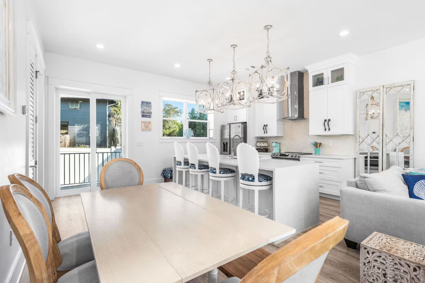 Spacious dining for 12! ️ Our large table seats 8, plus the sleek kitchen island seats 4 more. Perfect for big family meals or group retreats. A wide-open layout designed for togetherness and coastal entertaining in Blue Mountain Beach. ✨
