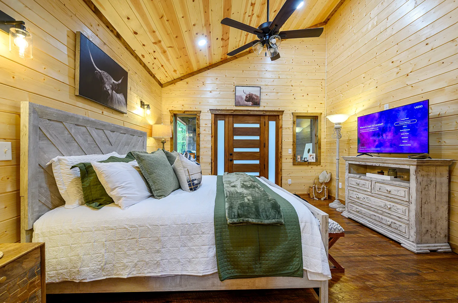 Spacious king bedroom featuring modern comfort and rustic elegance