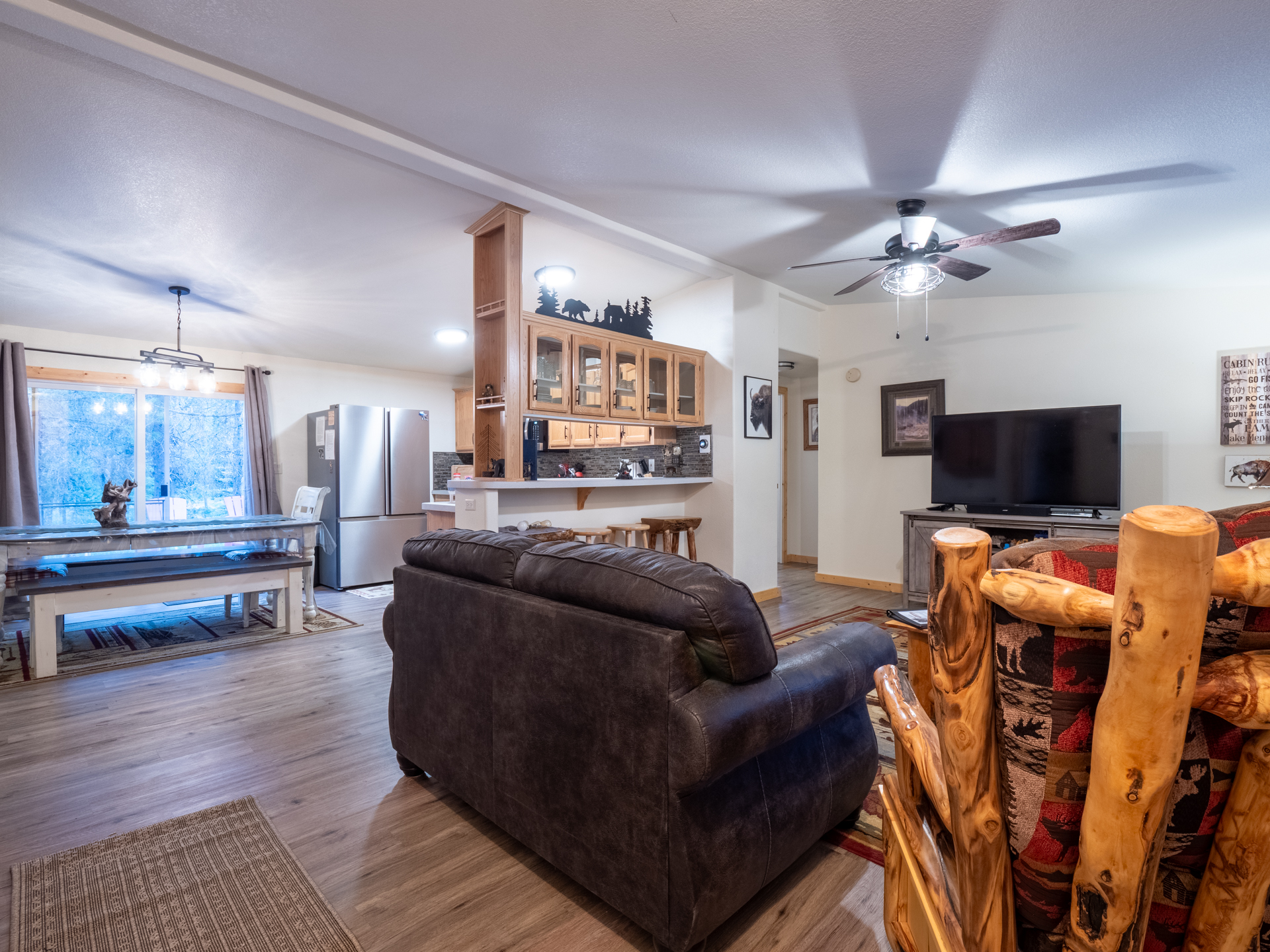 Open concept to living and kitchen along with patio doors to back deck