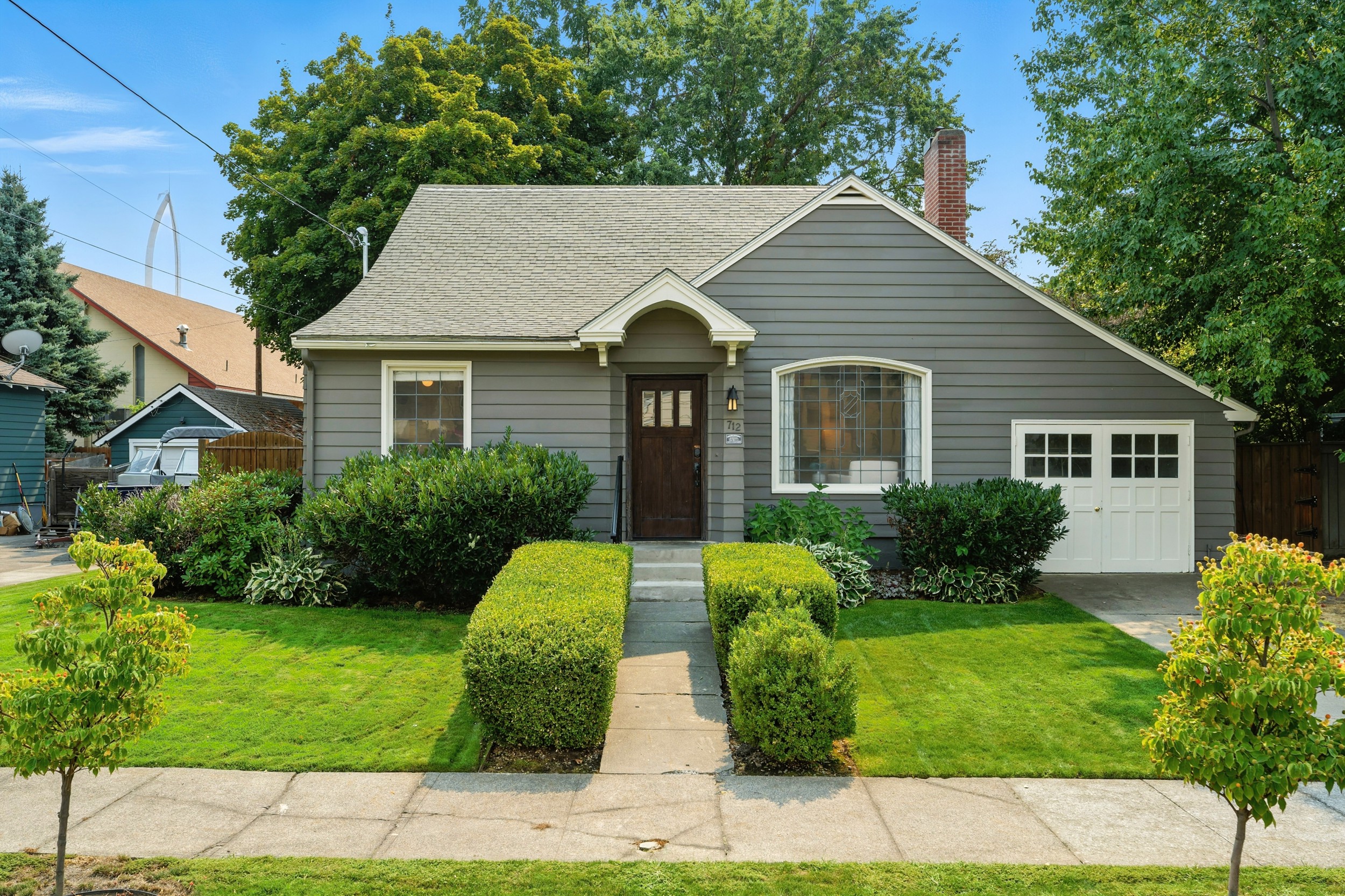 Front entrance with one off-street parking spot in front of the garage
