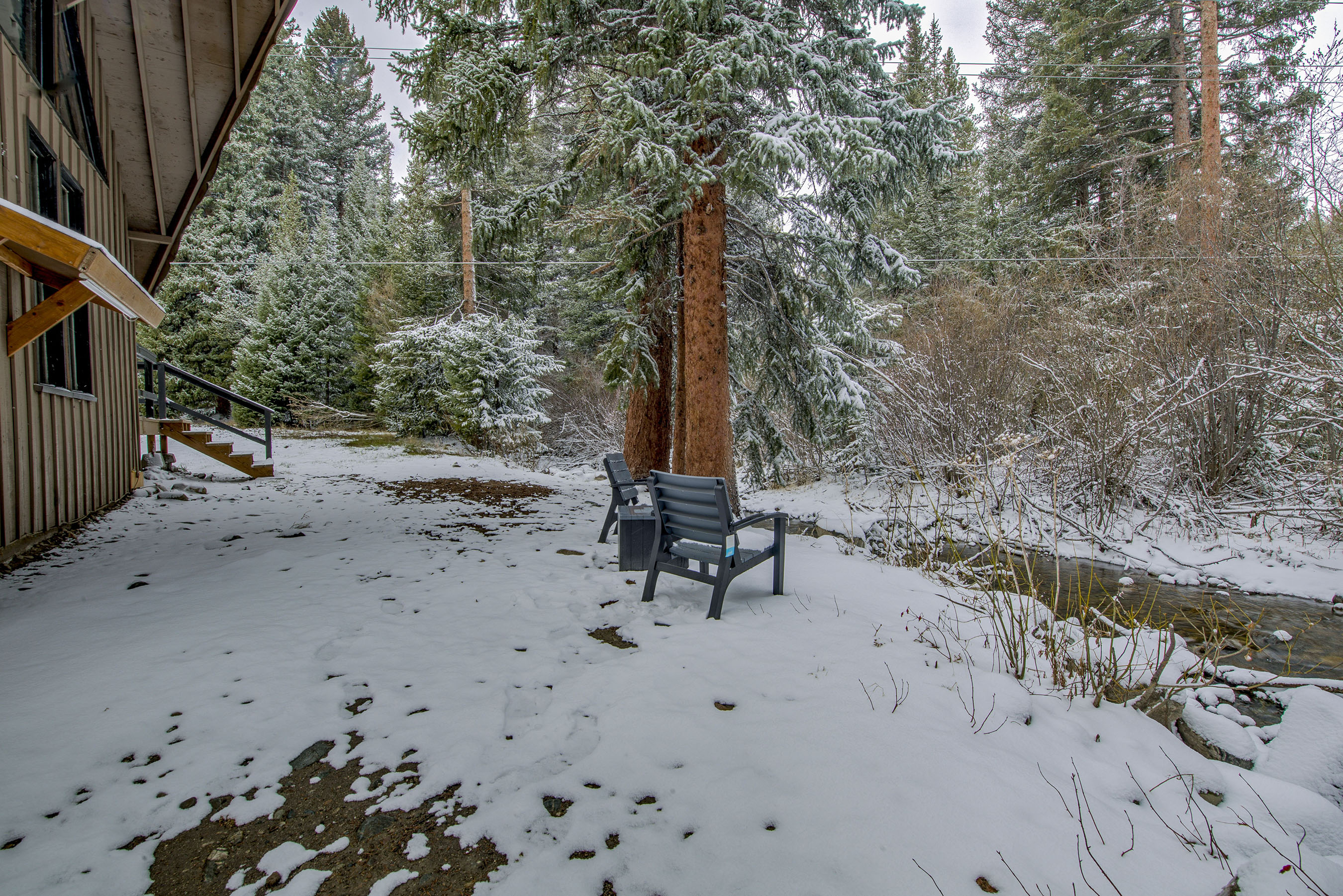 Step outside to your snowy retreat—peaceful creekside seating and fresh mountain air make it the perfect spot to unwind and enjoy nature at your pace.