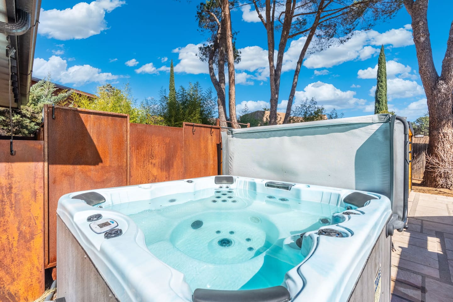 Private outdoor hot tub with privacy screening — the perfect spot to relax under Sedona’s blue skies and starry nights.
