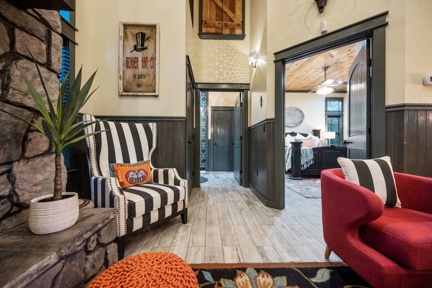 The open-concept living space invites relaxation with plush seating and warm, natural tones.