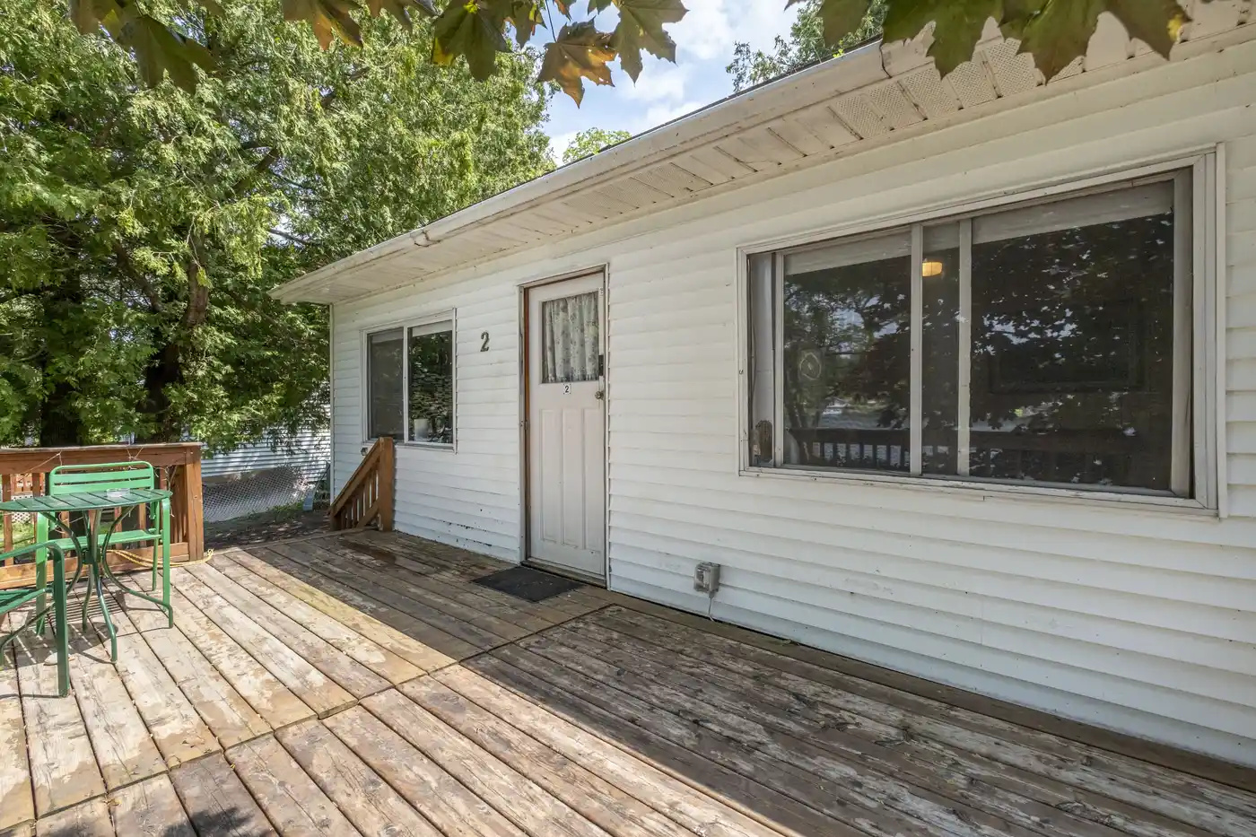 Exterior of Cottage #2 with spacious wooden deck