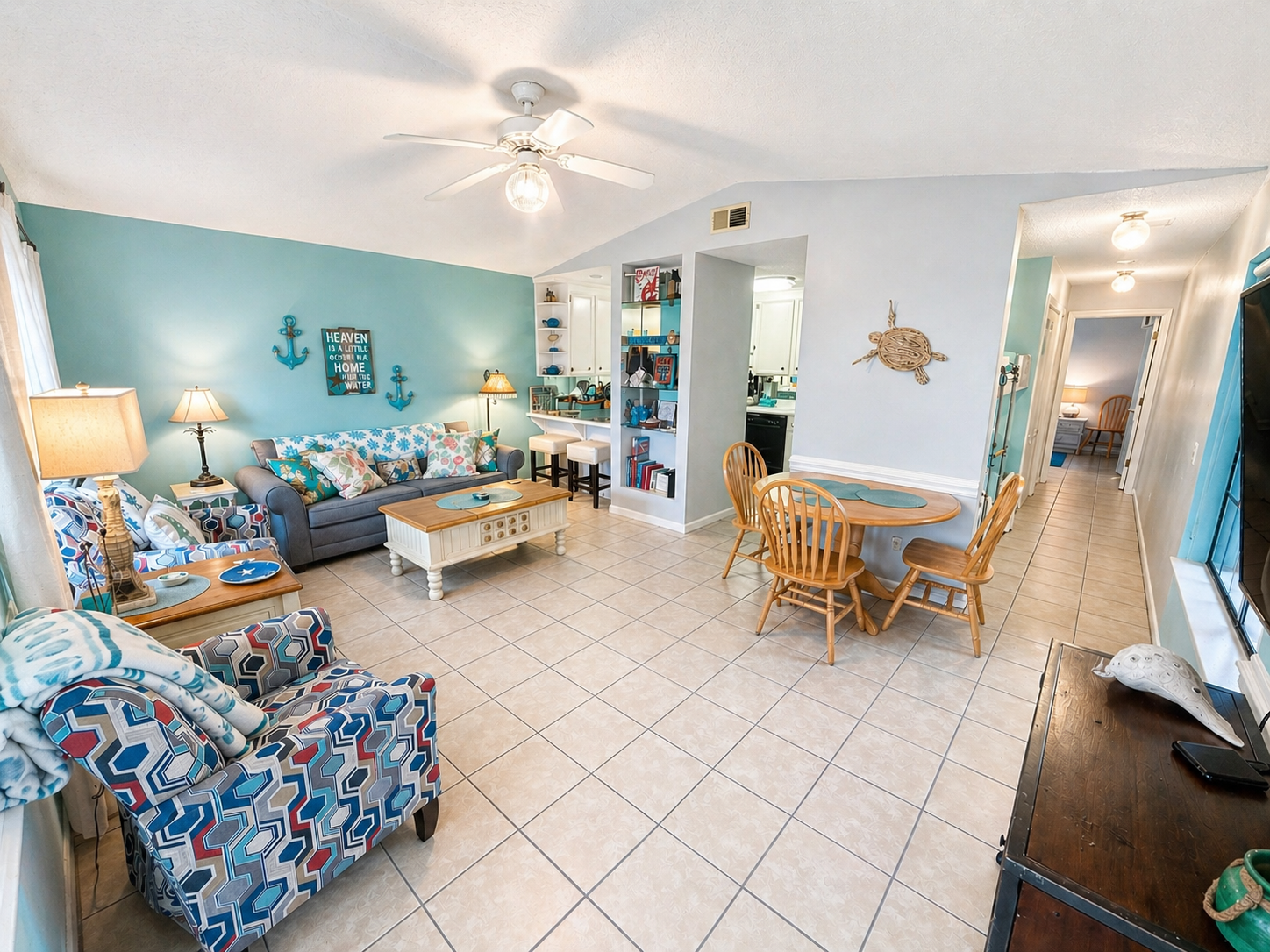 Open concept living area with vaulted ceilings