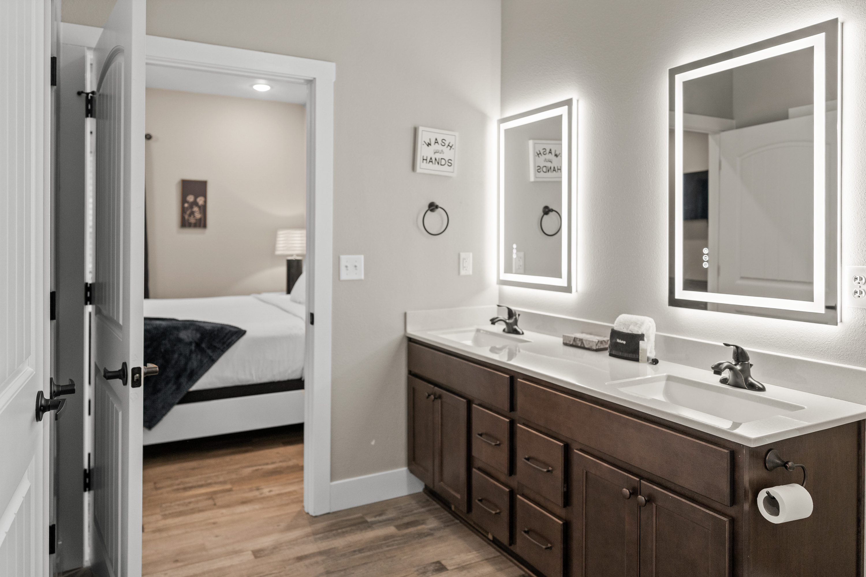 Master Bathroom #1 has his and her sinks with lighted mirrors and a large closet.
