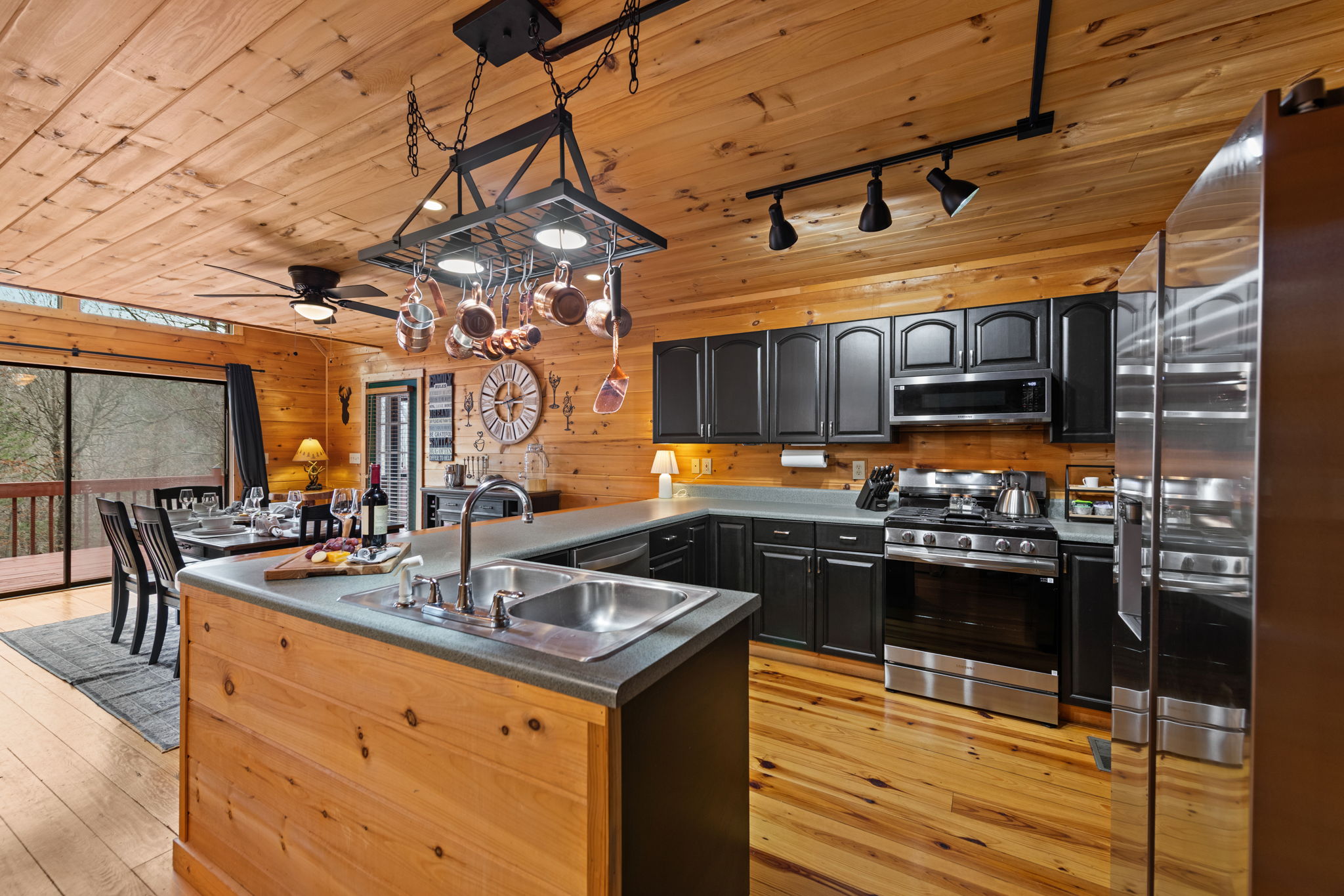 Its open layout flows seamlessly into the dining area, making it perfect for entertaining and gathering.