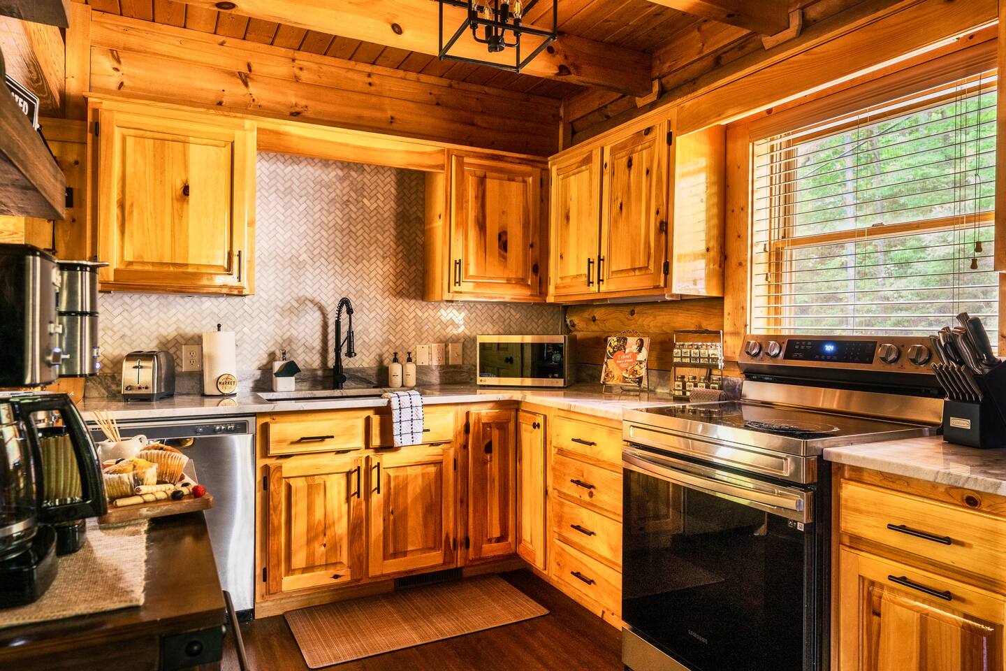 New renovated kitchen with granite countertops, marble backsplash, and stainless steel appliances. 