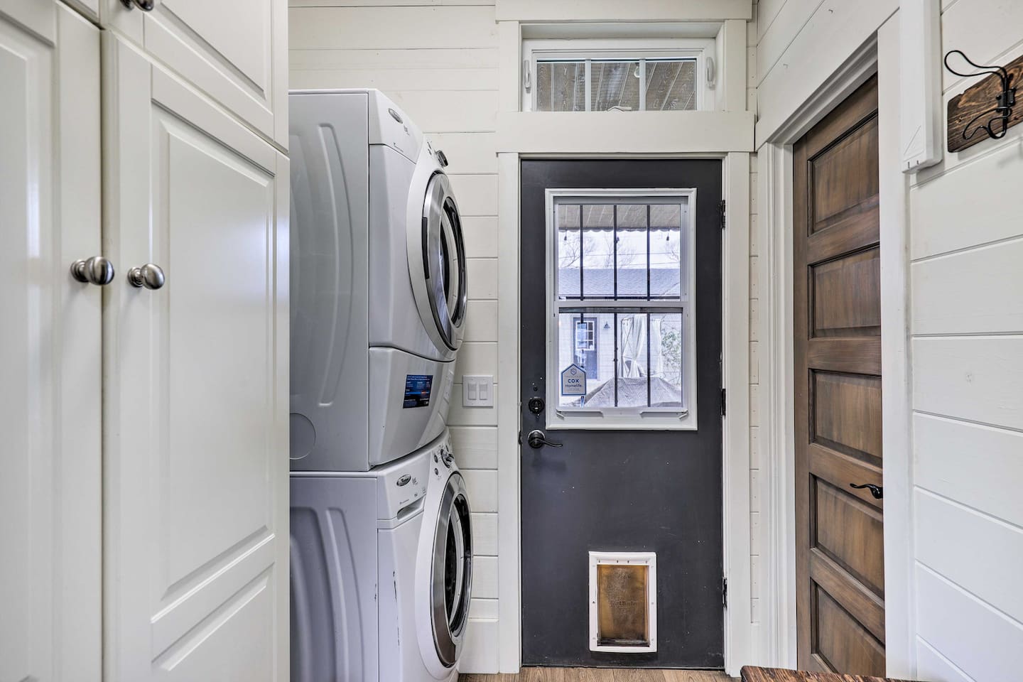 A stacked washer/dryer and back door make coming and going effortless.