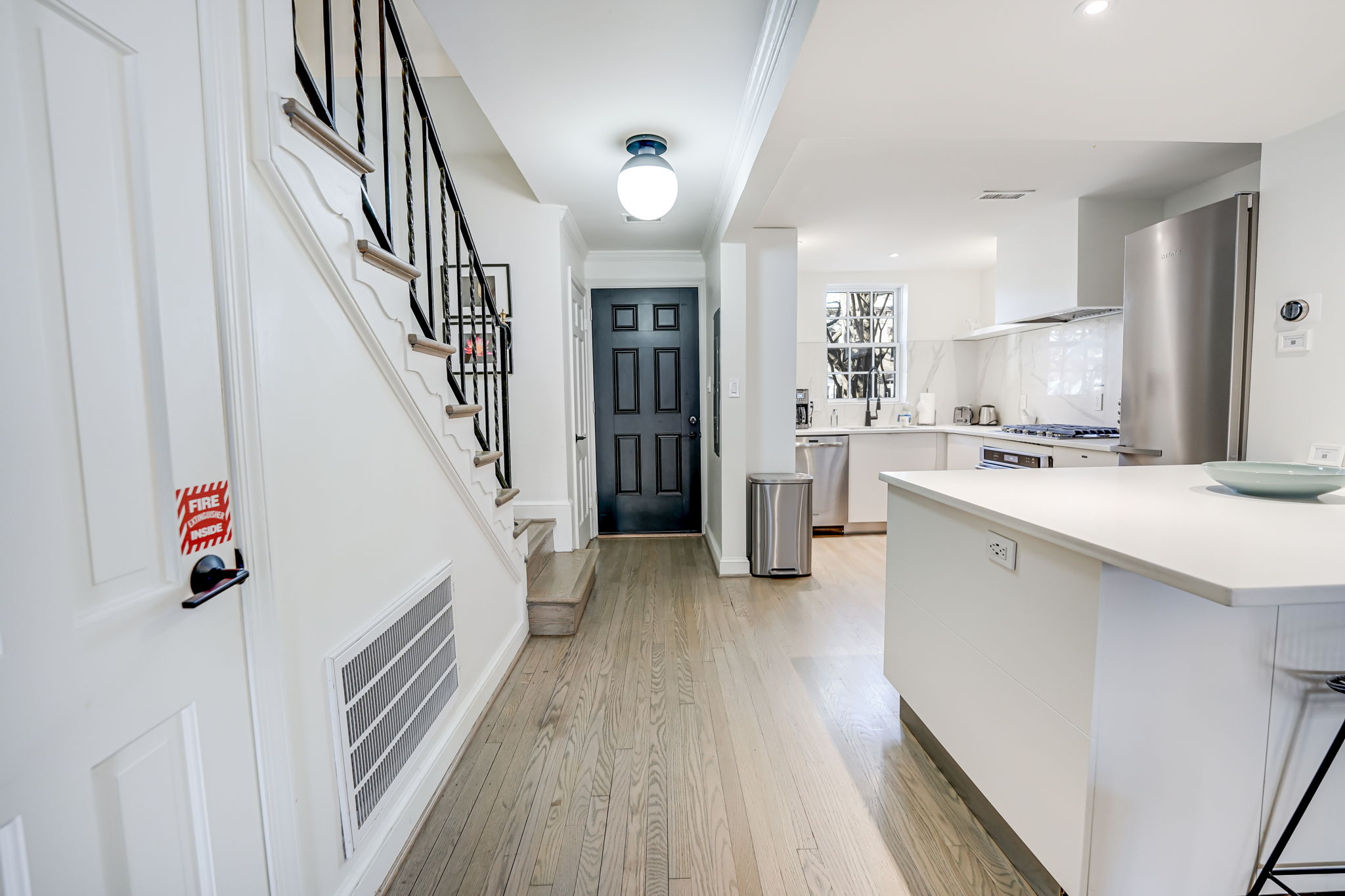 Front Entrance: Half Bath, Open Concept Kitchen & Island.