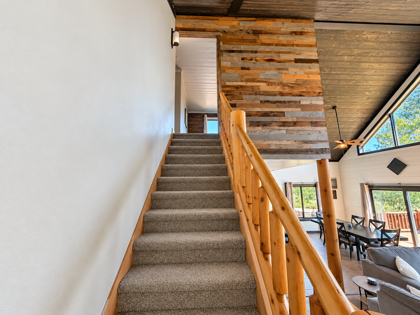 The upstairs is conveniently accessed just off the main living room, making it easy to move between the shared gathering space and upper-level bedrooms.