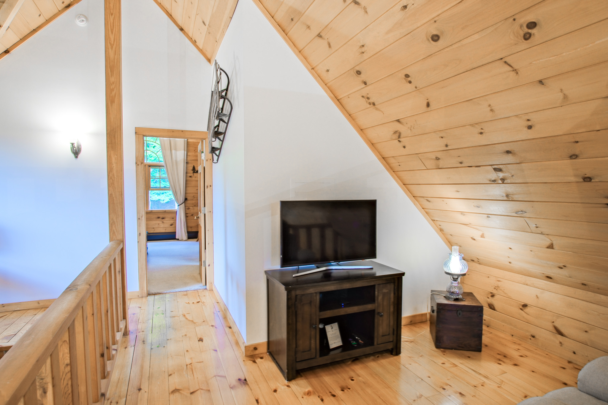 The mezzanine offers this perfect nootch to read a good book, and create a space for kids to watch a movie while the grown ups are downstairs. Did we mention the sofa is a recliner?