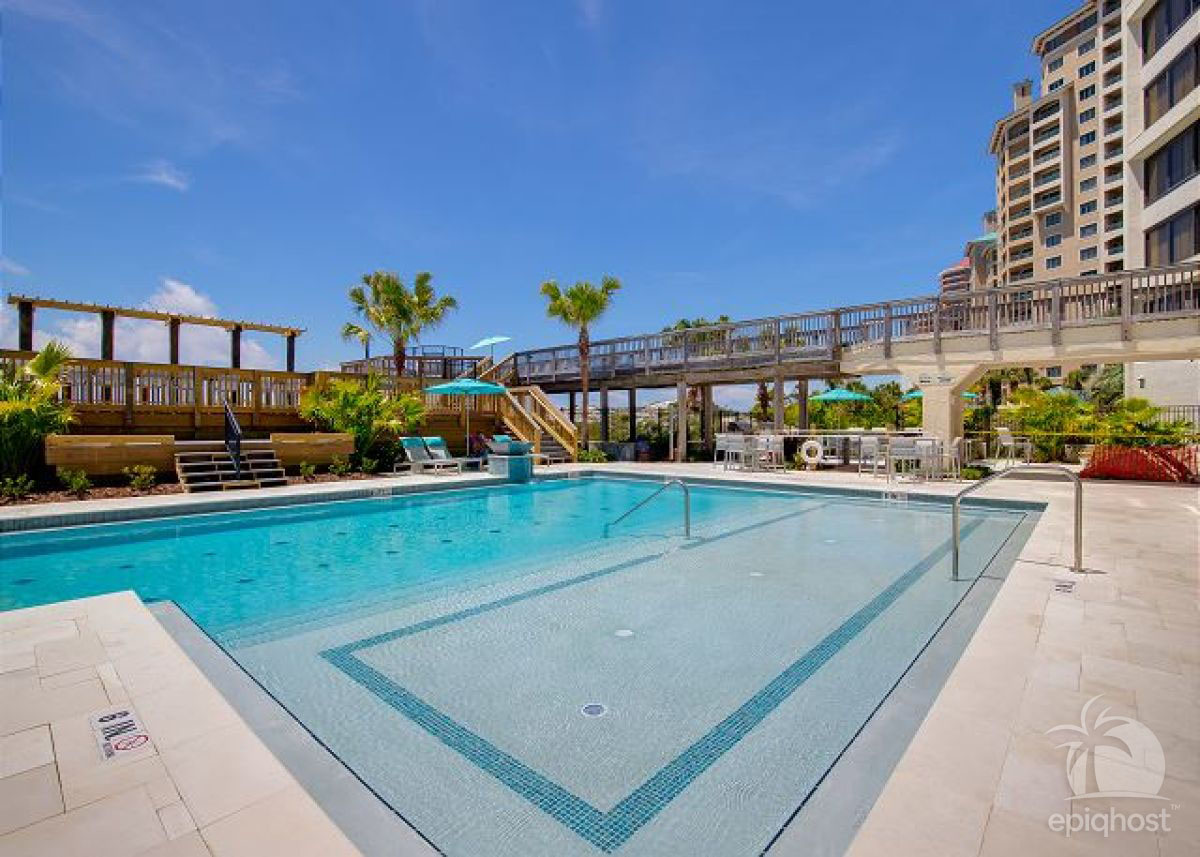 Pool and hot tub with covered lounge area