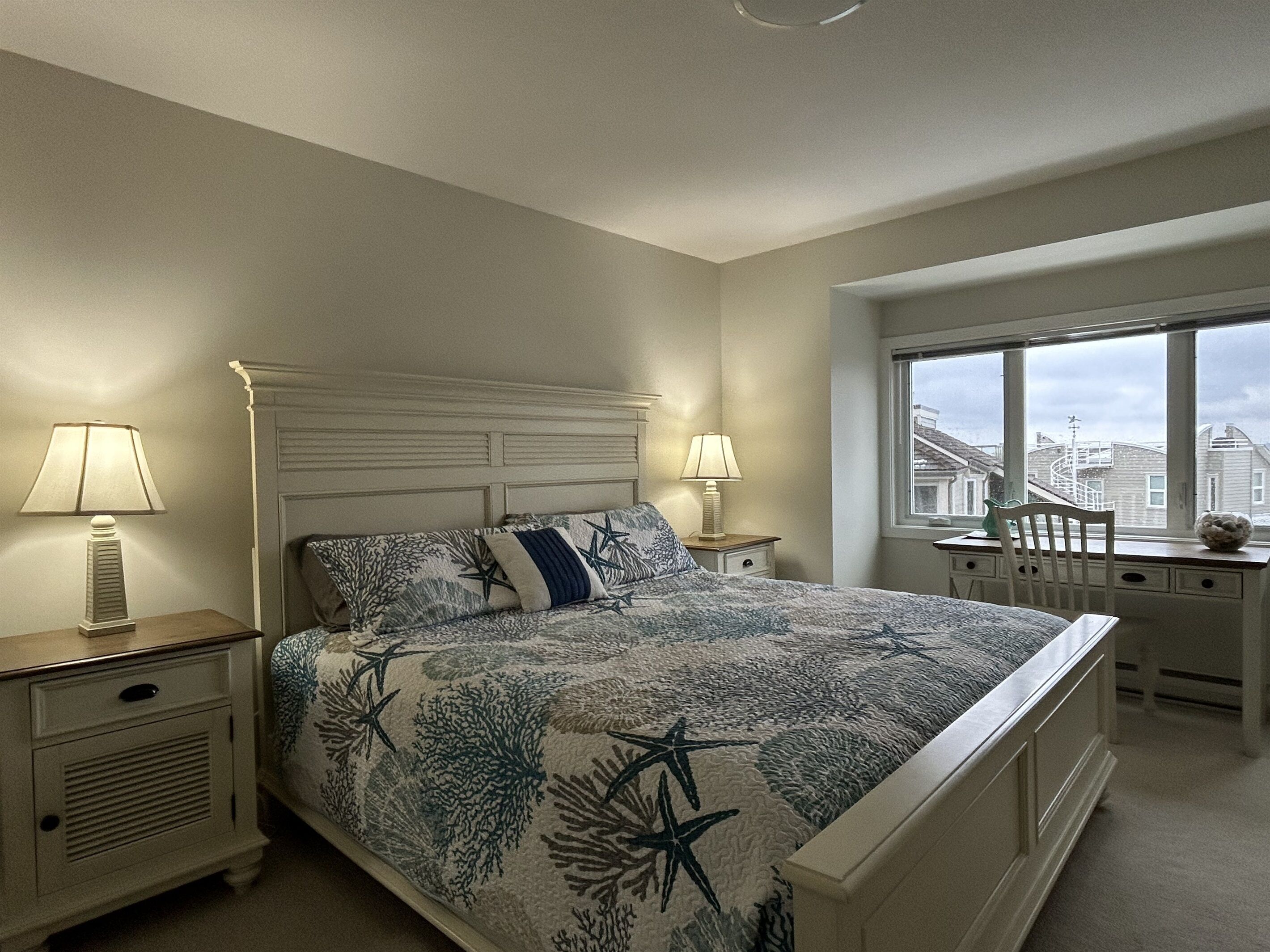 Primary king bedroom with private deck
