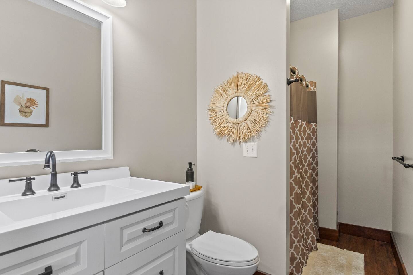 Full bathroom featuring modern fixtures, including a shower/tub, sink, and all the essentials for a comfortable stay.